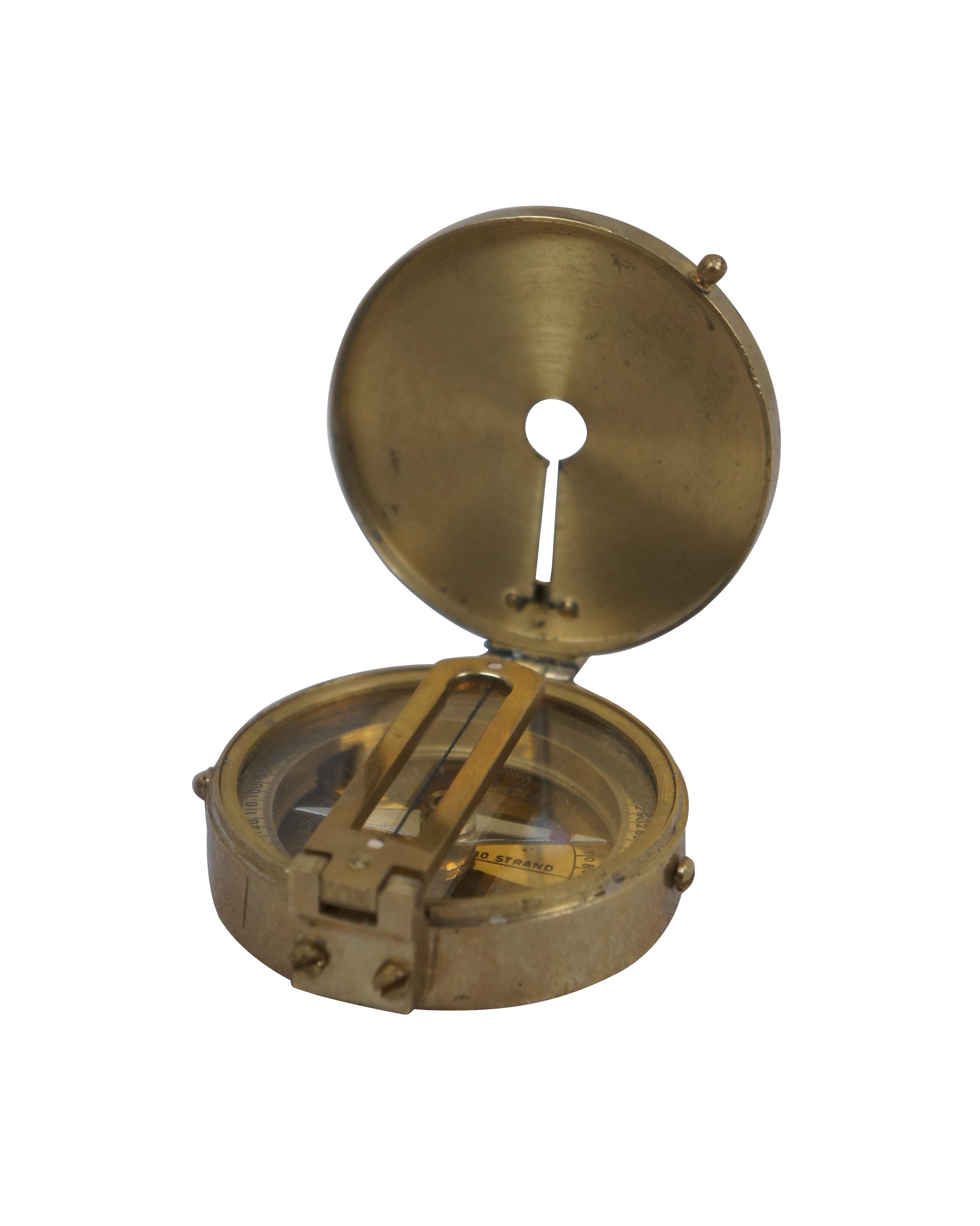 Antique Elliott Brothers of Ramsden, London brass surveyors / nautical maritime compass with brass case and face and folding sightline.

