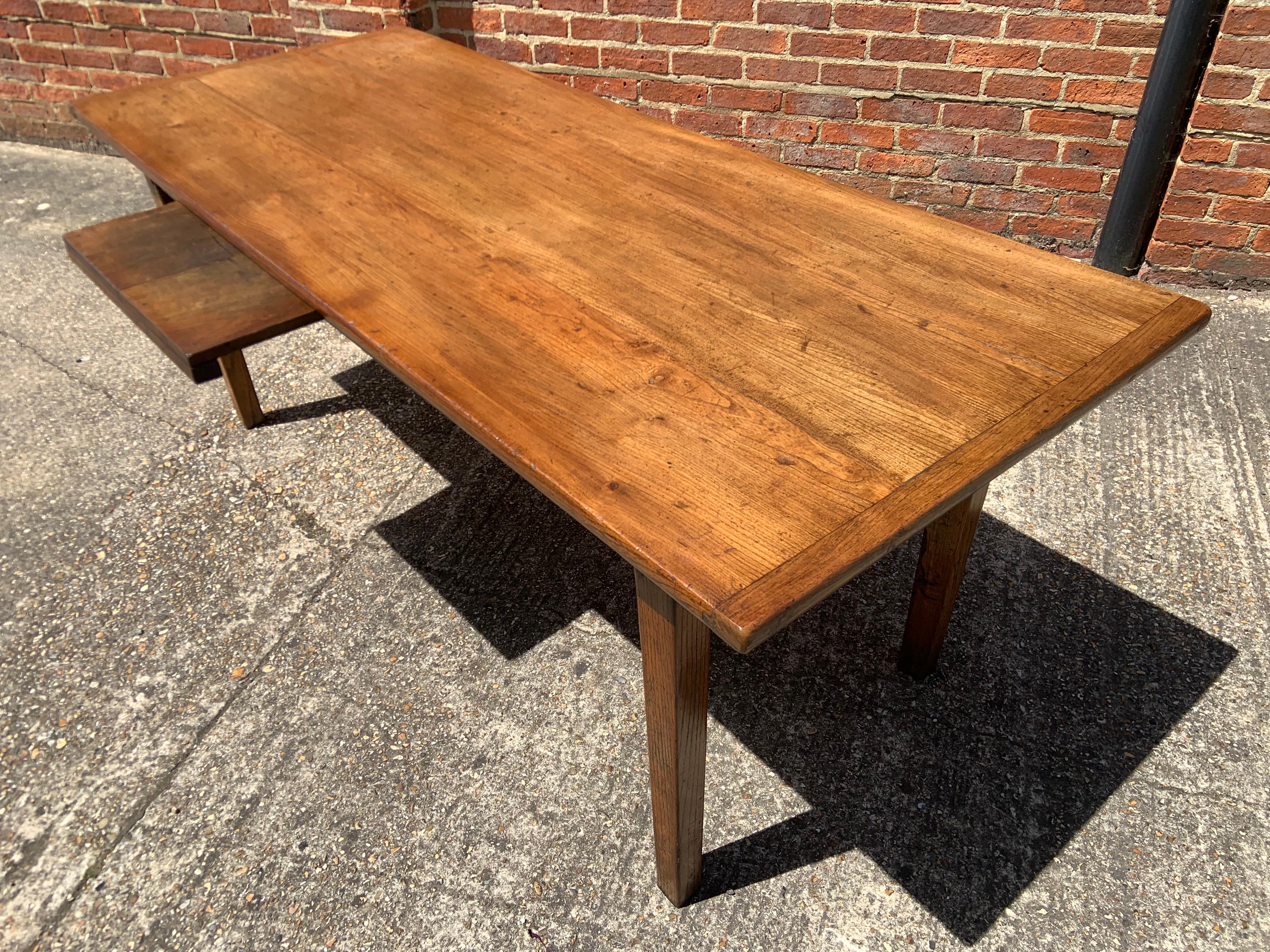 Antique Cherry Tapered Leg Dining Table with lovely wide top and cleated ends. The table has one good size drawer on one end. The patina to the top of the table is a mellow cherry with original colour and patina, which would fit well in a number of