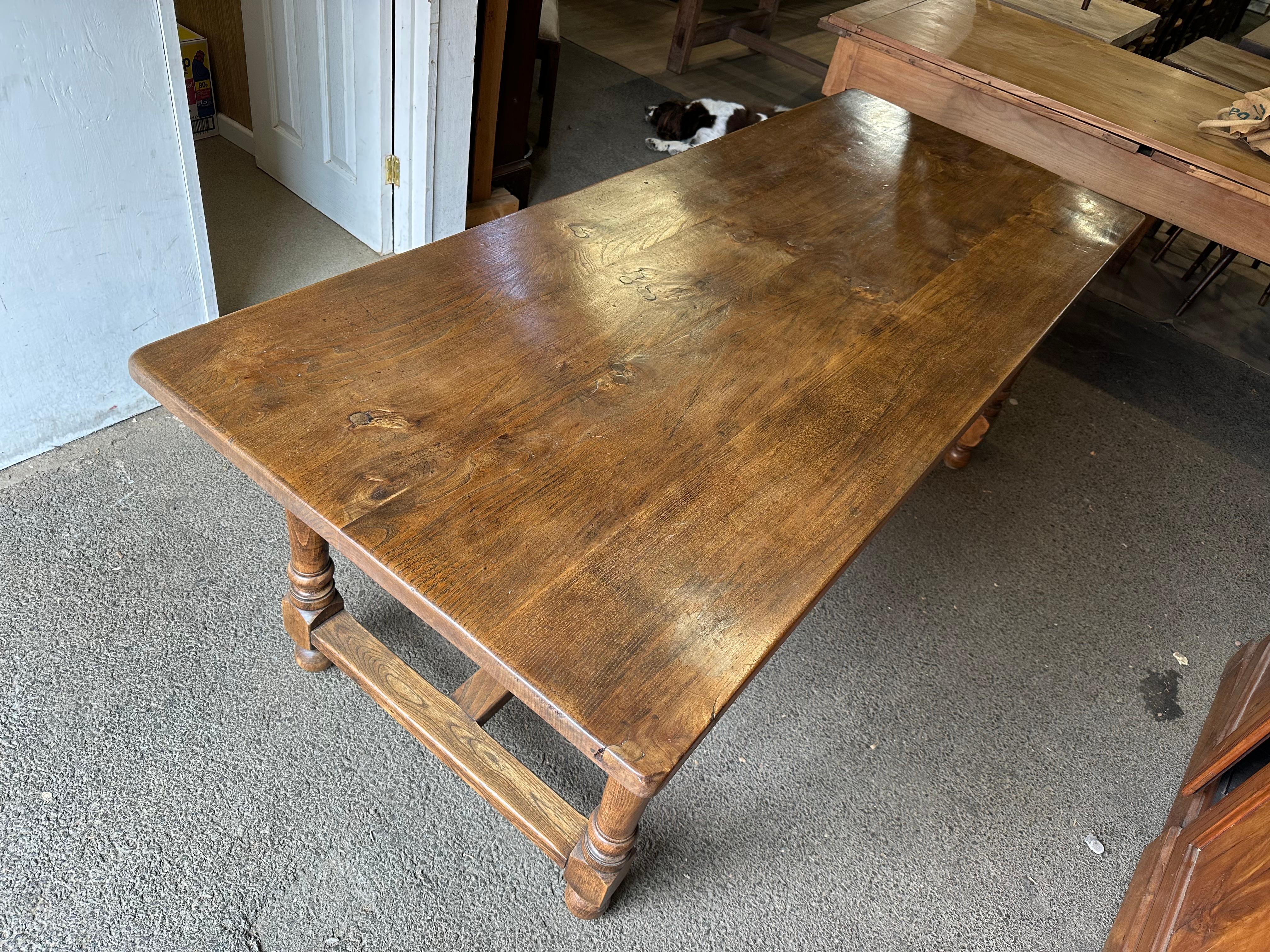 Antique Elm Turned Leg Dining Table. This early 19th century table has wonderful colour and patination. Beautiful lustrous feel that gives this table an elegant appearance. The table sits on sturdy base joined by centre and H stretcher. The legs a