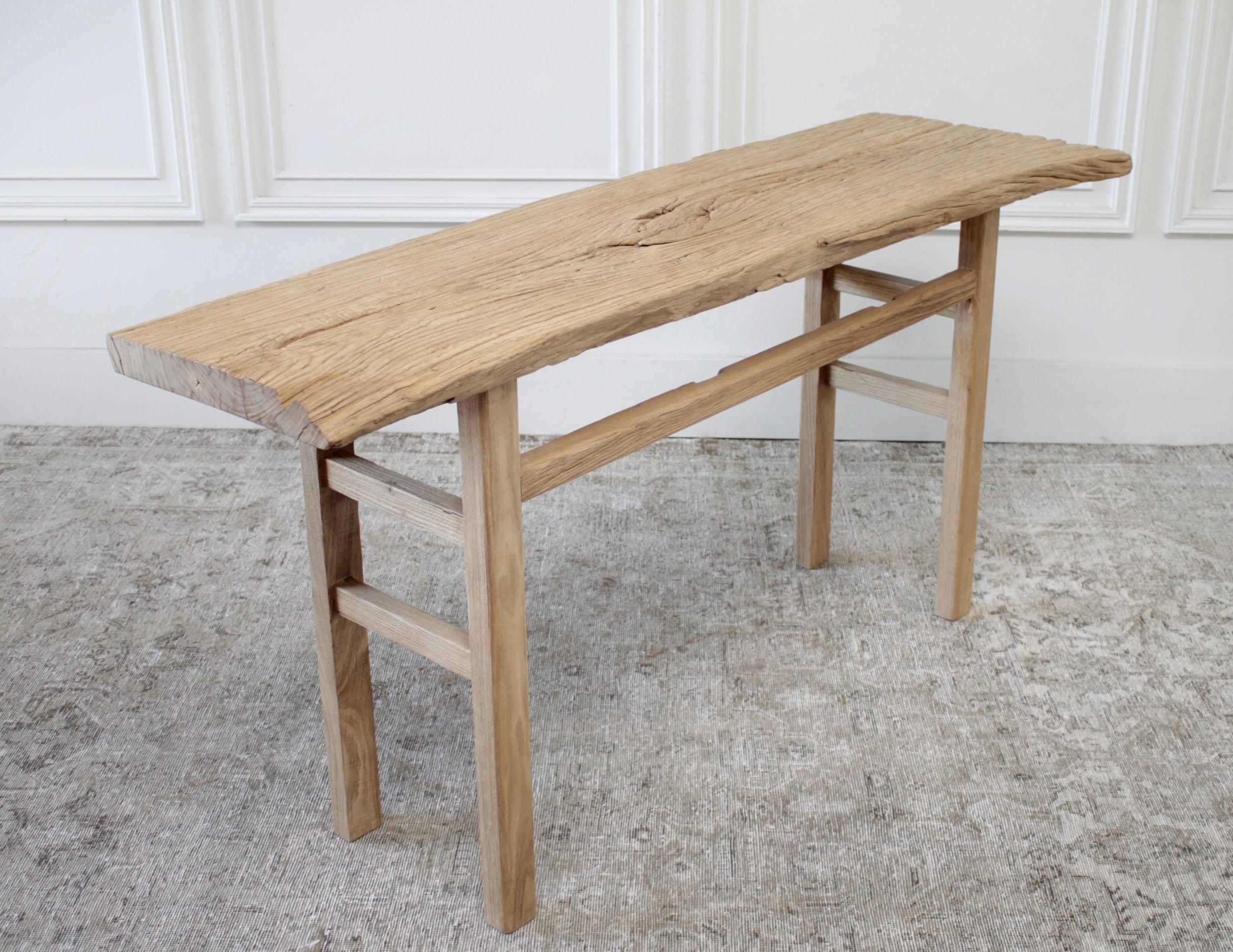 Antique elm wood plank console table
Vintage table has a natural edge, the shape of the tabletop is slightly wider on one side, as you can see the shape of the tree. Legs are solid and sturdy, the table base is made from reclaimed elm timbers, with
