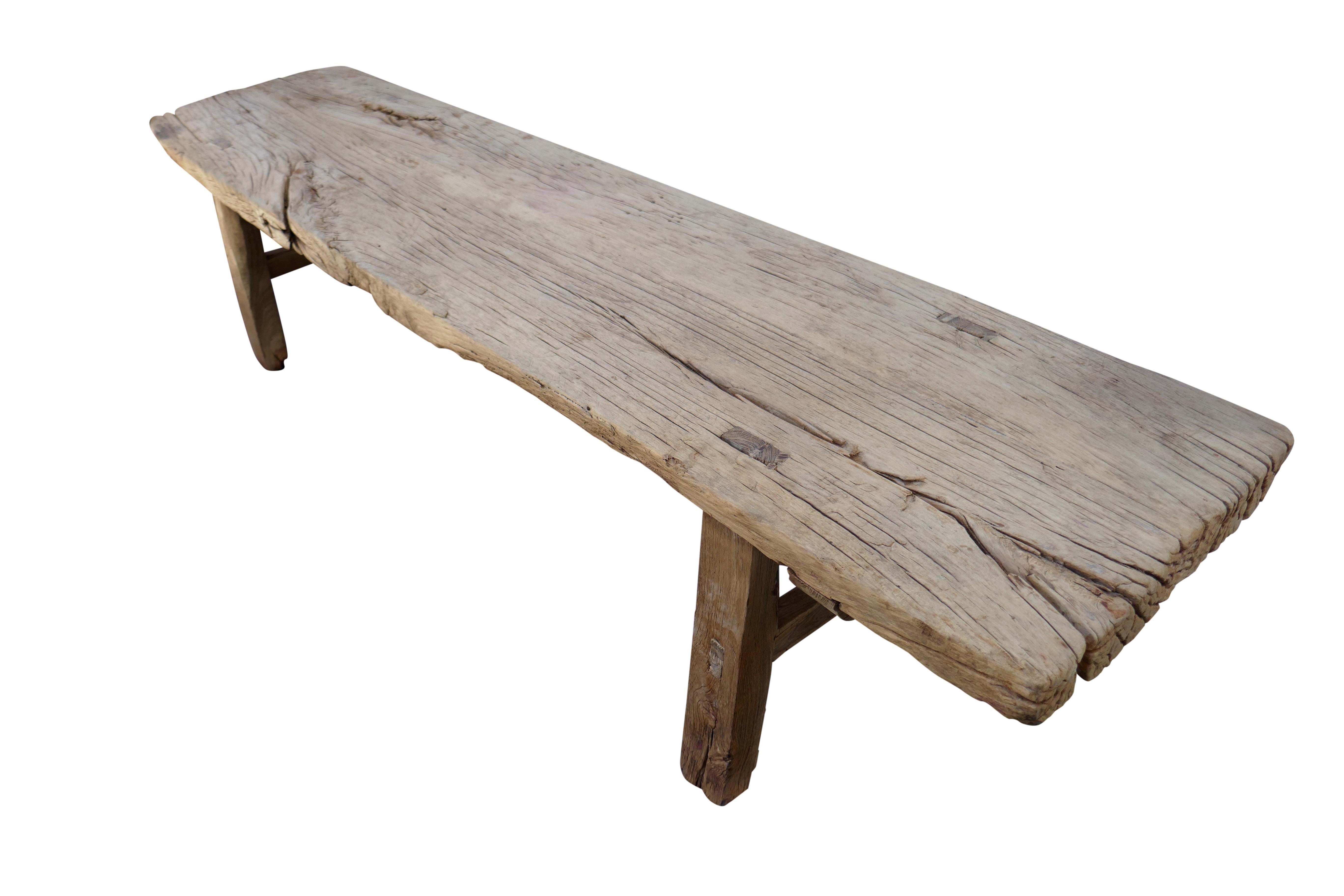 Authentic antique rustic elmwood bench/table. This one-of-a-kind versatile piece features desirable natural age character throughout that only time and history can create. The natural age and use patina incorporated into the surface of the wood
