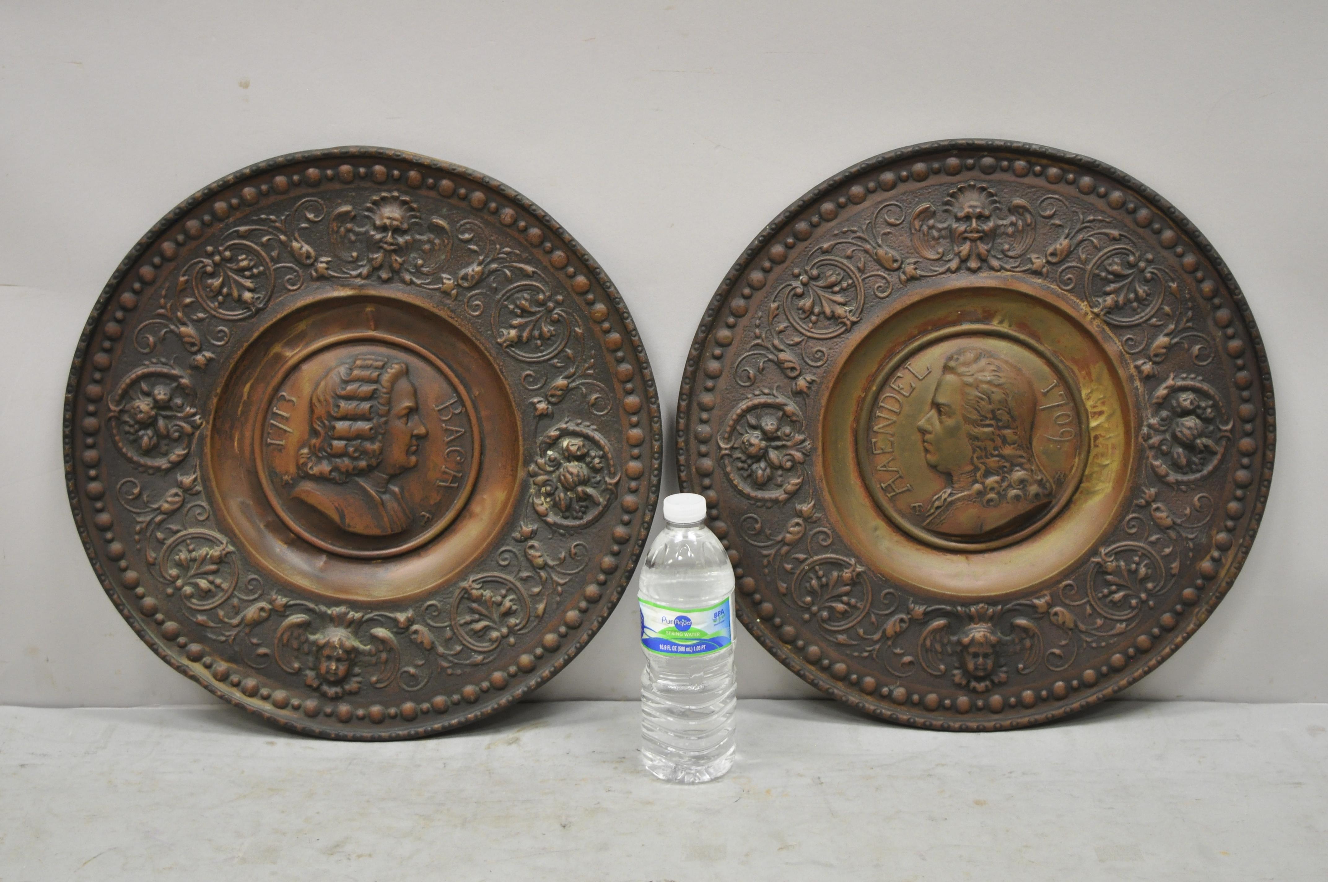 Antique Embossed Copper Neoclassical Bach and Haendel charger plates - a Pair. Set include (2) chargers, (1) Bach, (1) Haendel. Measurements: 1