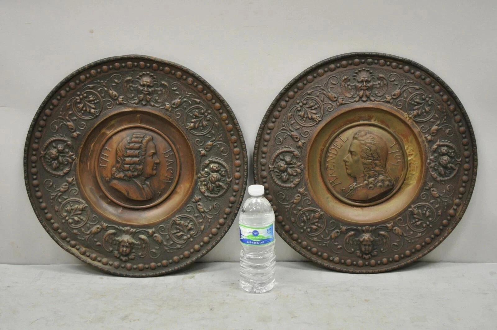 Antique Embossed Copper Neoclassical Bach and Haendel Charger Plates - a Pair. Listing includes (2) chargers, (1) Bach, (1) Haendel. Circa Early 20th Century. Measurements: 1