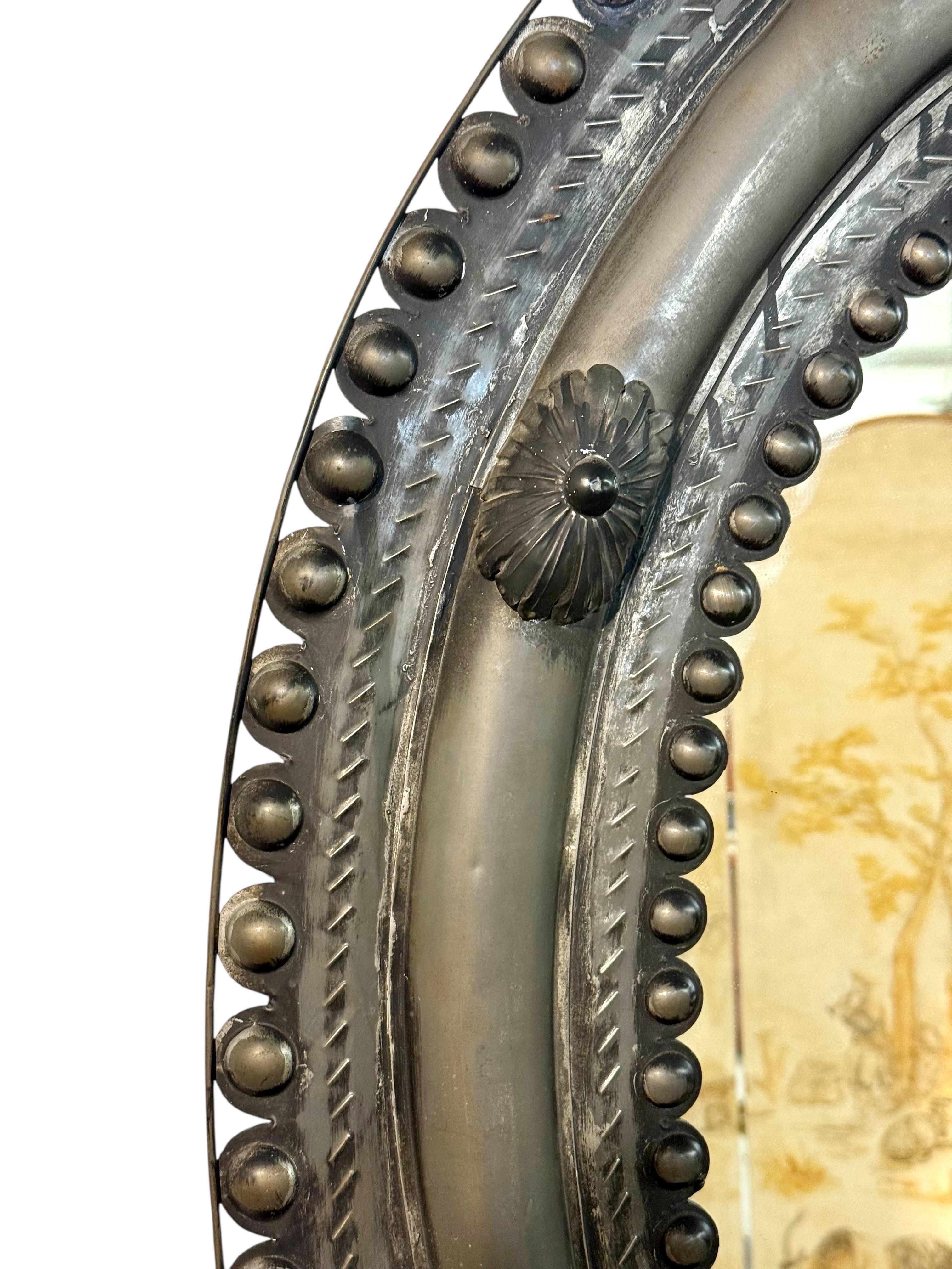 Antique Embossed Metal Oval Mirror with Cabochons and Rosettes In Good Condition For Sale In LA CIOTAT, FR