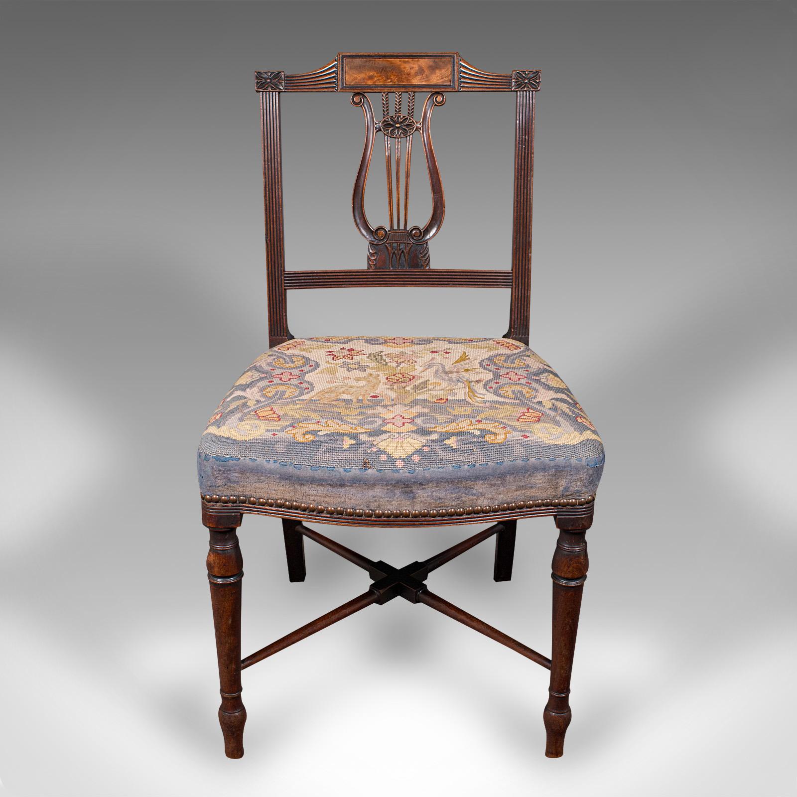 This is an antique embroidered lyre back chair. An English, walnut and needlepoint bedroom or hall seat, dating to the Regency period, circa 1820.

Endearing needlepoint covering and a fascinating frame accentuate this fine seat
Displays a desirable