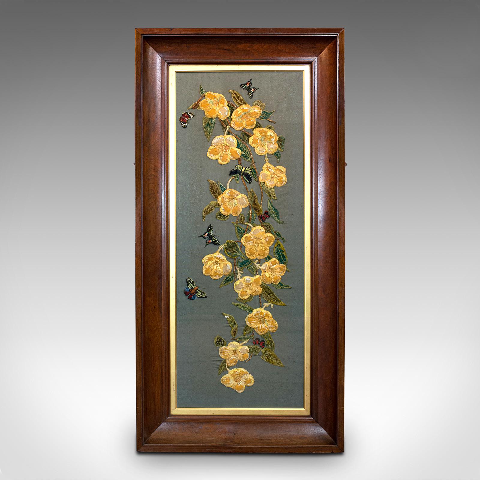 This is an antique embroidered silk panel. An Oriental, chestnut and glass brocante decorative frieze, dating to the late Victorian period, circa 1900.

Beautiful craftsmanship throughout
Displays a desirable aged patina
Broad chestnut frame