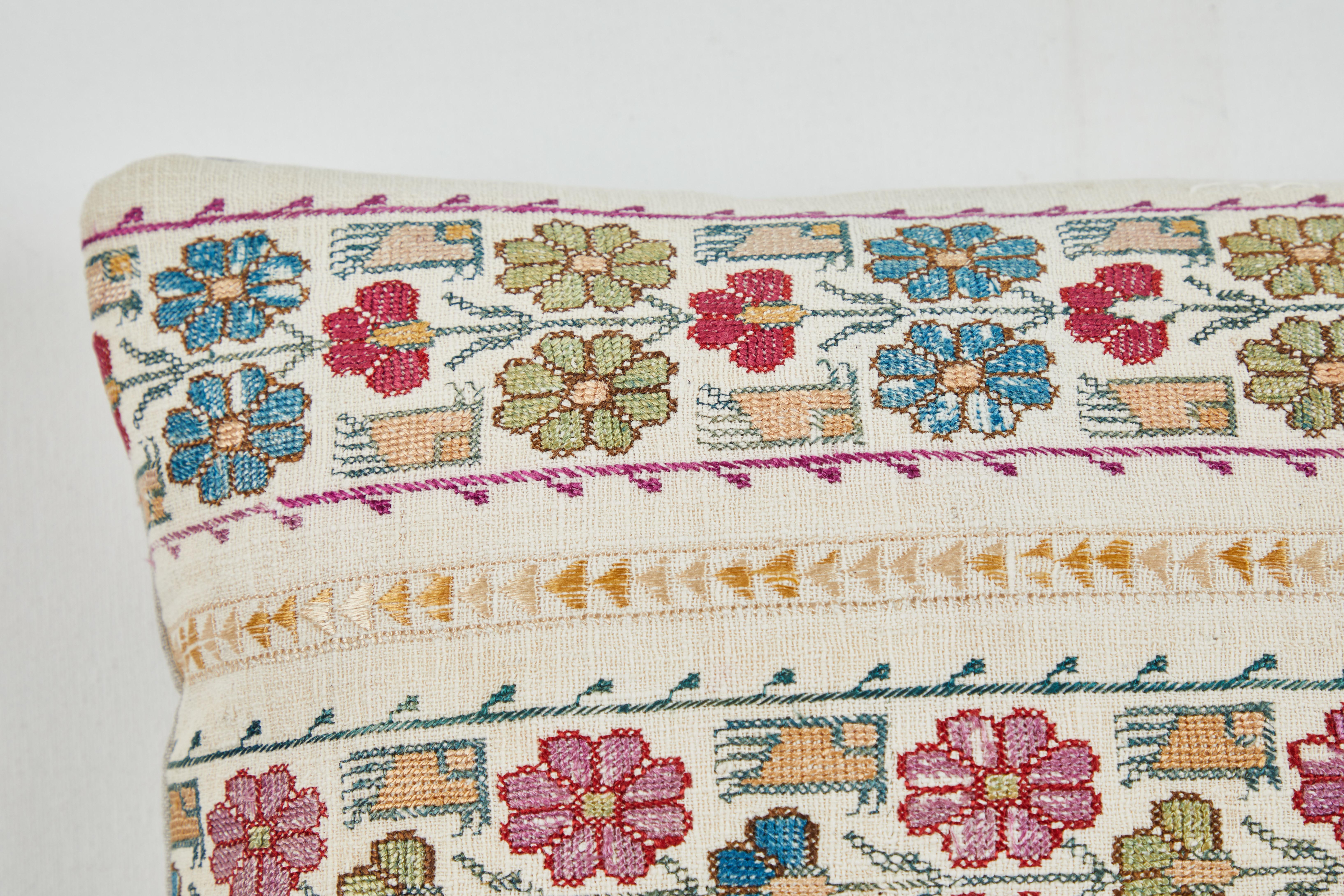 Ottoman influenced handwork pillow. Green, blue, teal, red, pink and gold silk stitching on handwoven linen. Natural linen back, feather and down fill, invisible zipper closure.
 