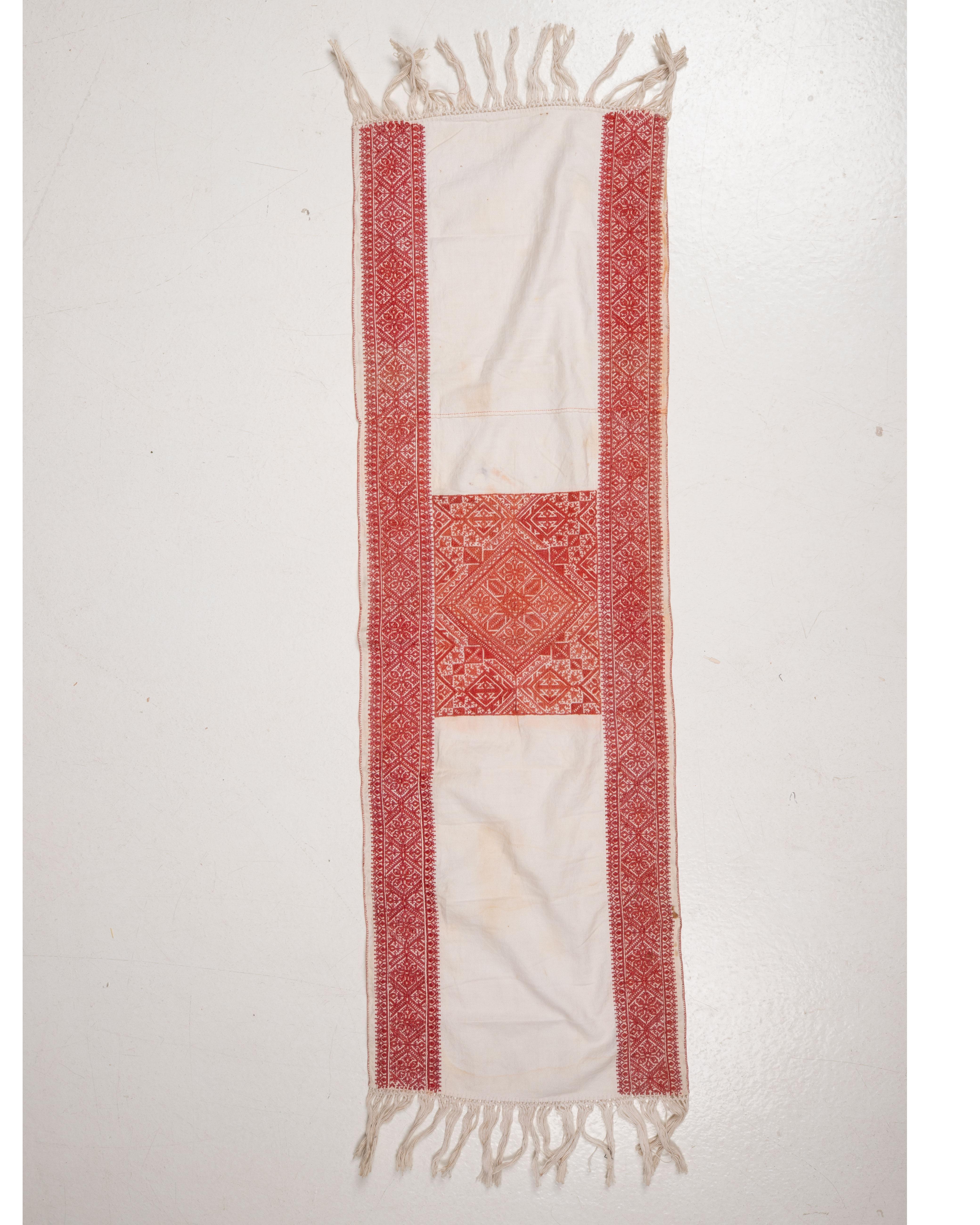 Fez embroidery was among the most sophisticated textile arts of Morocco, practiced by women in domestic settings and highly prized as part of marriage furnishings. The geometric patterning resonates with Andalusian and Islamic artistic traditions,