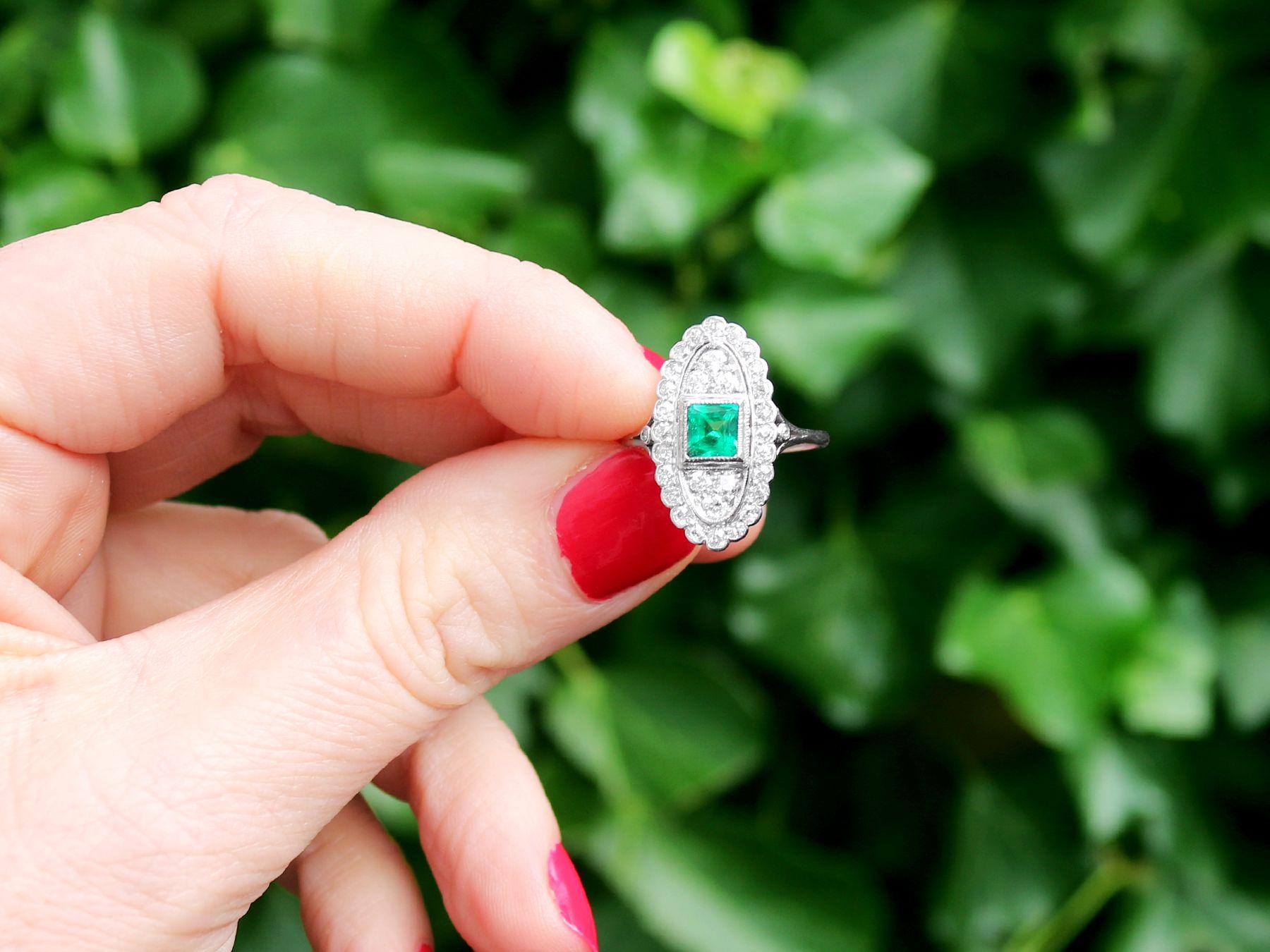 A stunning, fine and impressive antique 0.57 carat emerald and 1.20 carat diamond, platinum dress ring; part of our diverse antique estate jewelry collections.

This stunning, fine and impressive antique emerald ring has been crafted in