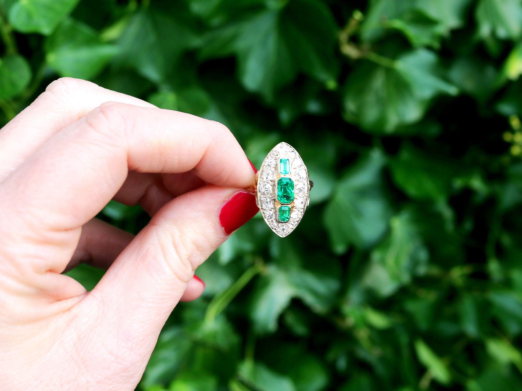 A stunning antique 1.76 carat emerald and 2.05 carat emerald, 18k yellow gold marquise 
shaped dress ring; part of our diverse antique jewelry and estate jewelry collections.

This stunning, fine and impressive antique emerald cut emerald ring has