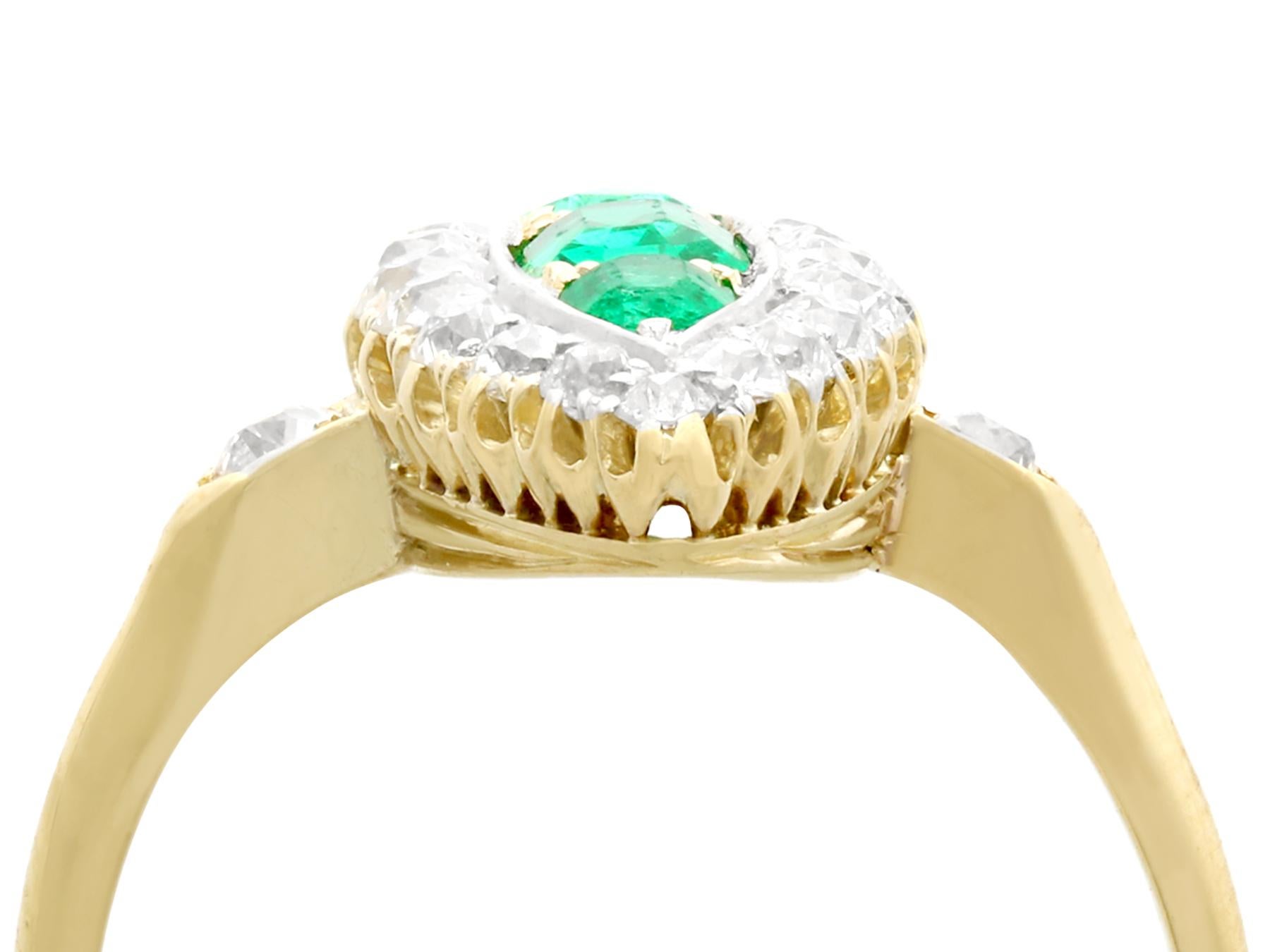 A fine and impressive antique 0.92 carat emerald and 1.38 carat diamond, 15 karat yellow gold marquise ring; part of our diverse antique jewelry collections.

This fine and impressive antique emerald cut emerald and diamond ring has been crafted in