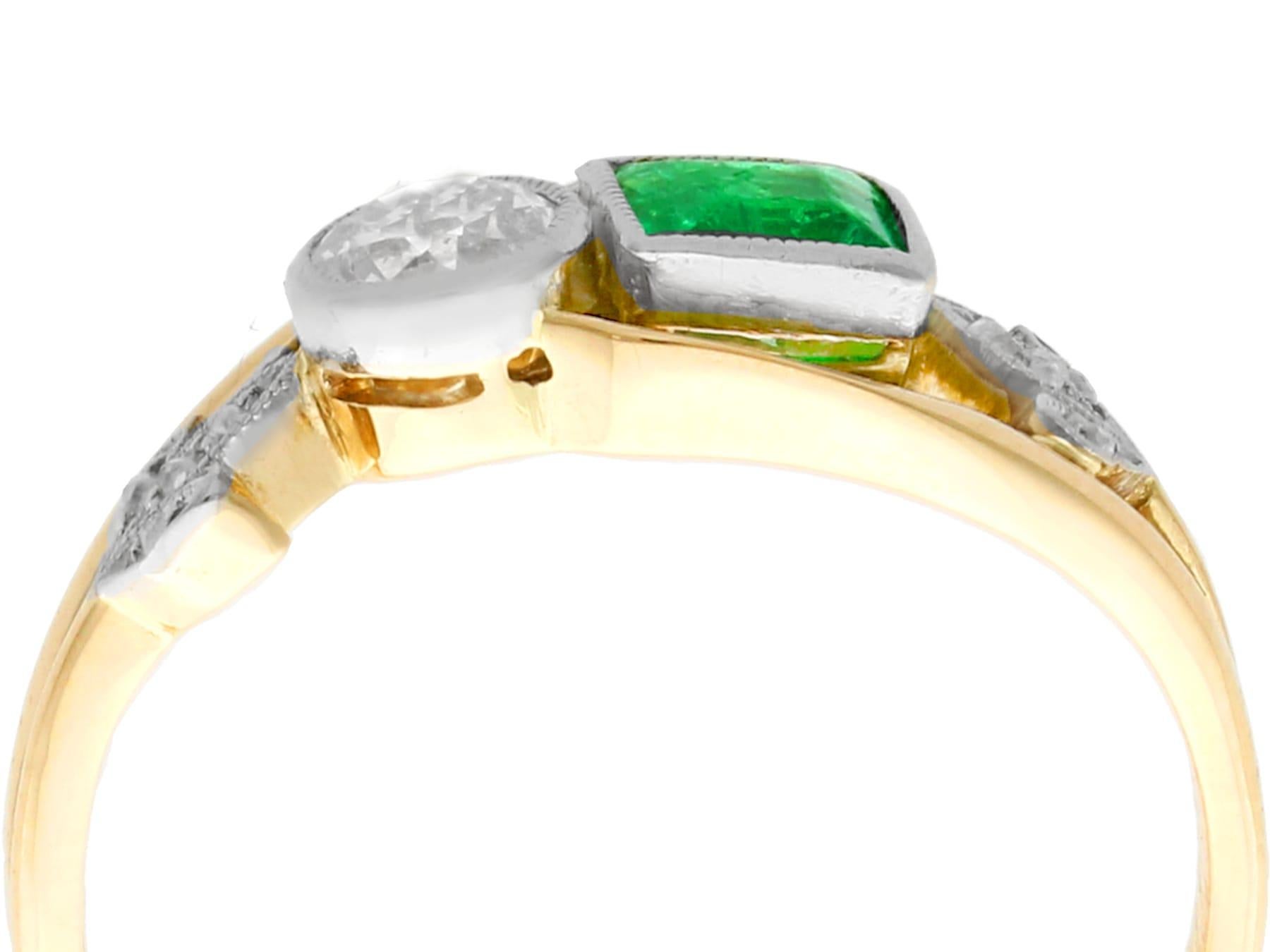 A fine and impressive antique 0.30 carat emerald and 0.22 carat diamond, 14 karat yellow gold and platinum set twist ring; part of our diverse antique jewelry collections.

This fine and impressive antique emerald ring has been crafted in 14k yellow