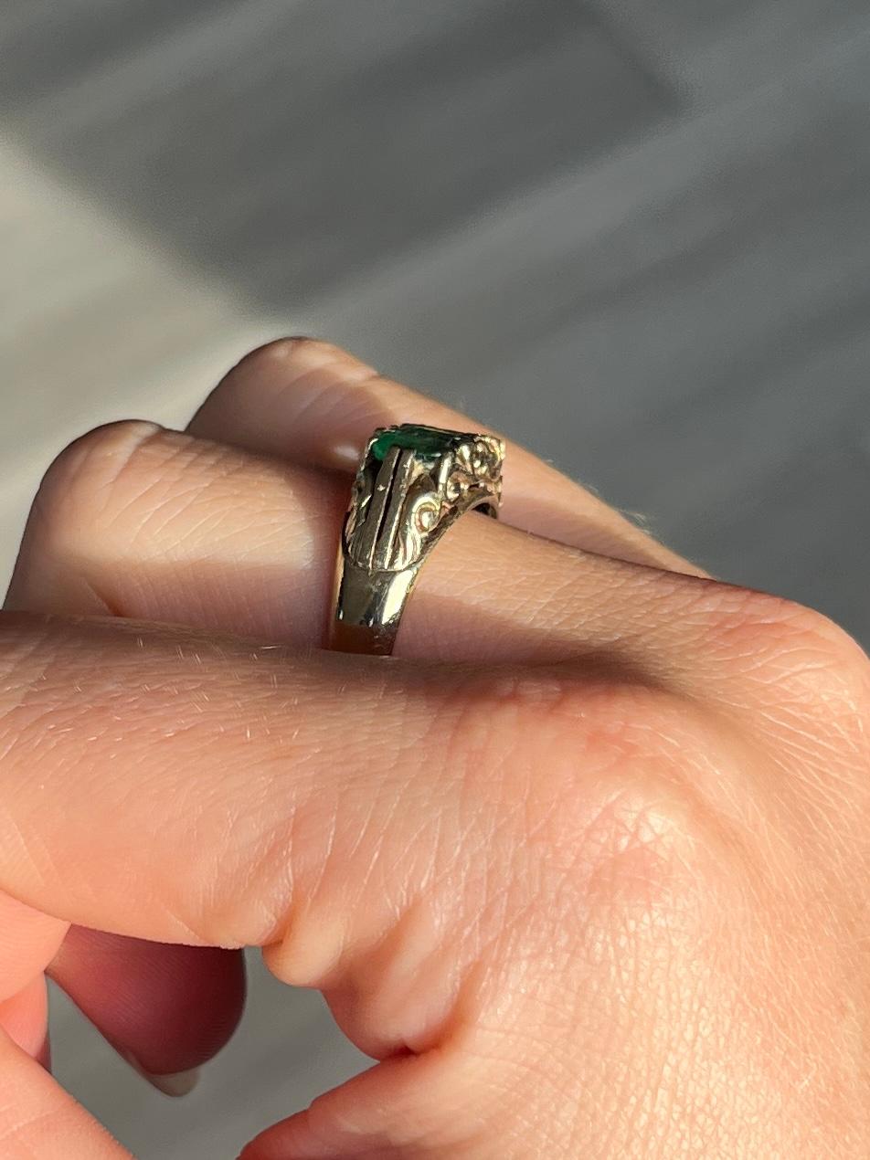 The emeralds in the ring are so bright and a wonderful colour. The emerald measure 45pts each and there are diamond points in-between. Fully hallmarked Chester 1921.

Ring Size: O 1/2 or 7 1/2 
Height Off Finger: 4.5mm

Weight: 5.2g