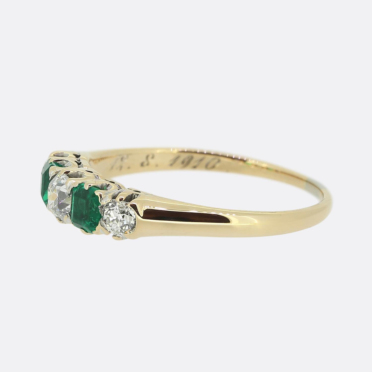 Here we have a charming five-stone ring. This antique piece has been crafted from 18ct yellow gold and showcases five precious gemstones individually claw in a single line formation in a slight convex fashion across the face. At the centre we find a