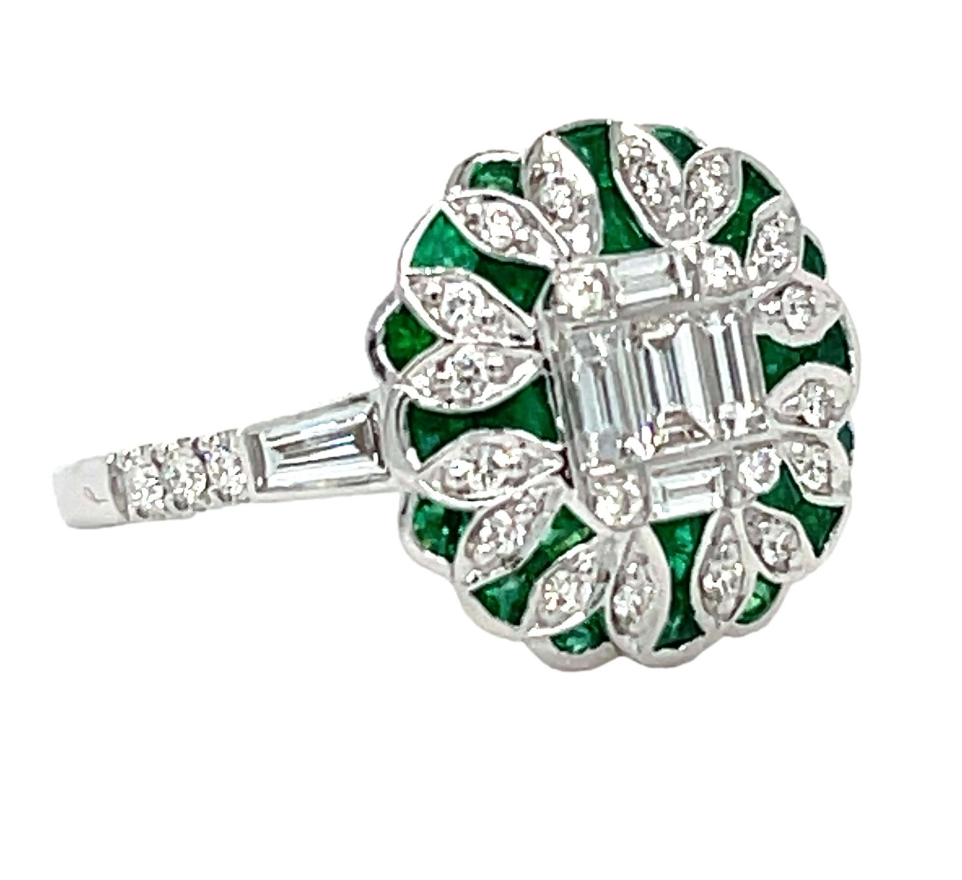 This stunning ring has natural Emerald and Diamonds set in 18 karat white gold. There are sparkling tapered and round diamonds on the shank for a delicate accent. This ring will be shipped in a beautiful box, ready for the perfect gift! The ring is