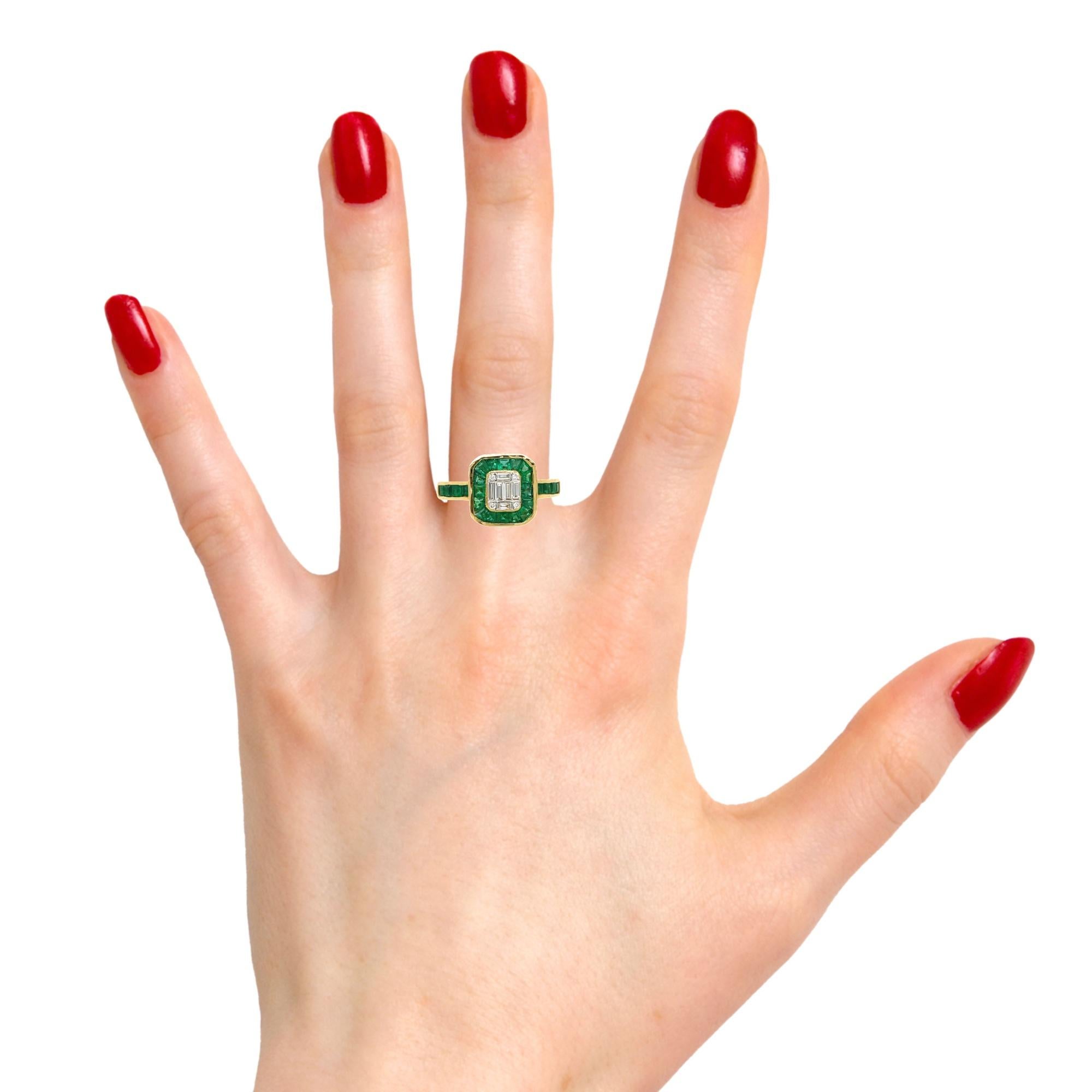 This stunning ring has natural Emeralds and Diamonds set in 18 karat yellow gold. There are sparkling baguette and round diamonds in the center surrounded by channel set emeralds. There are Princess cut emerald on the shank for a delicate accent.