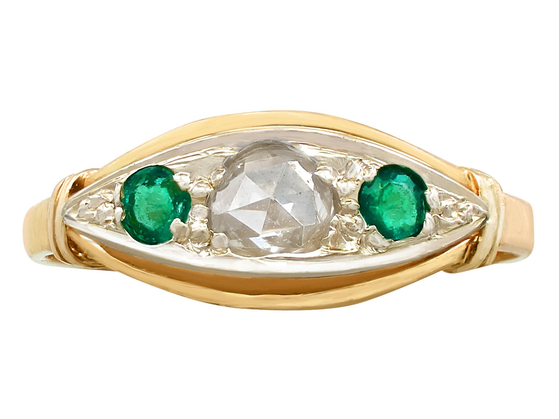 A fine antique 1930s 0.18 carat emerald and 0.30 carat diamond, 18 karat yellow gold and silver set dress ring; part of our diverse antique jewelry and estate jewelry collections.

This fine antique emerald and diamond ring has been crafted in 18k
