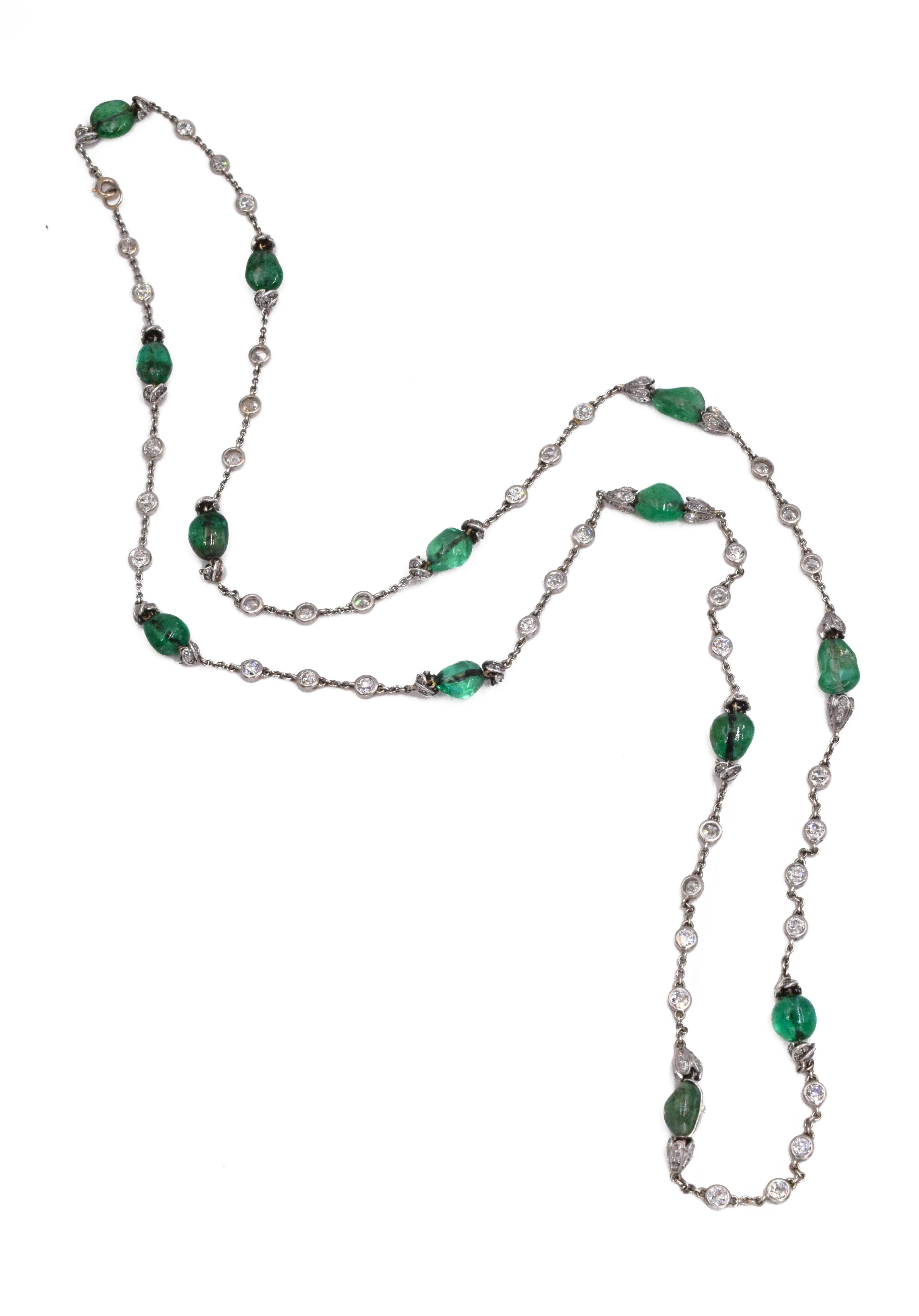 Antique French Emerald Bead and Diamond Longchain Necklace. This necklace has tumbled emerald beads, old, single and rose-cut diamonds, all set in 18k white gold and platinum. French Hallmarks Length: 37 1⁄4 ins., circa 1915. 