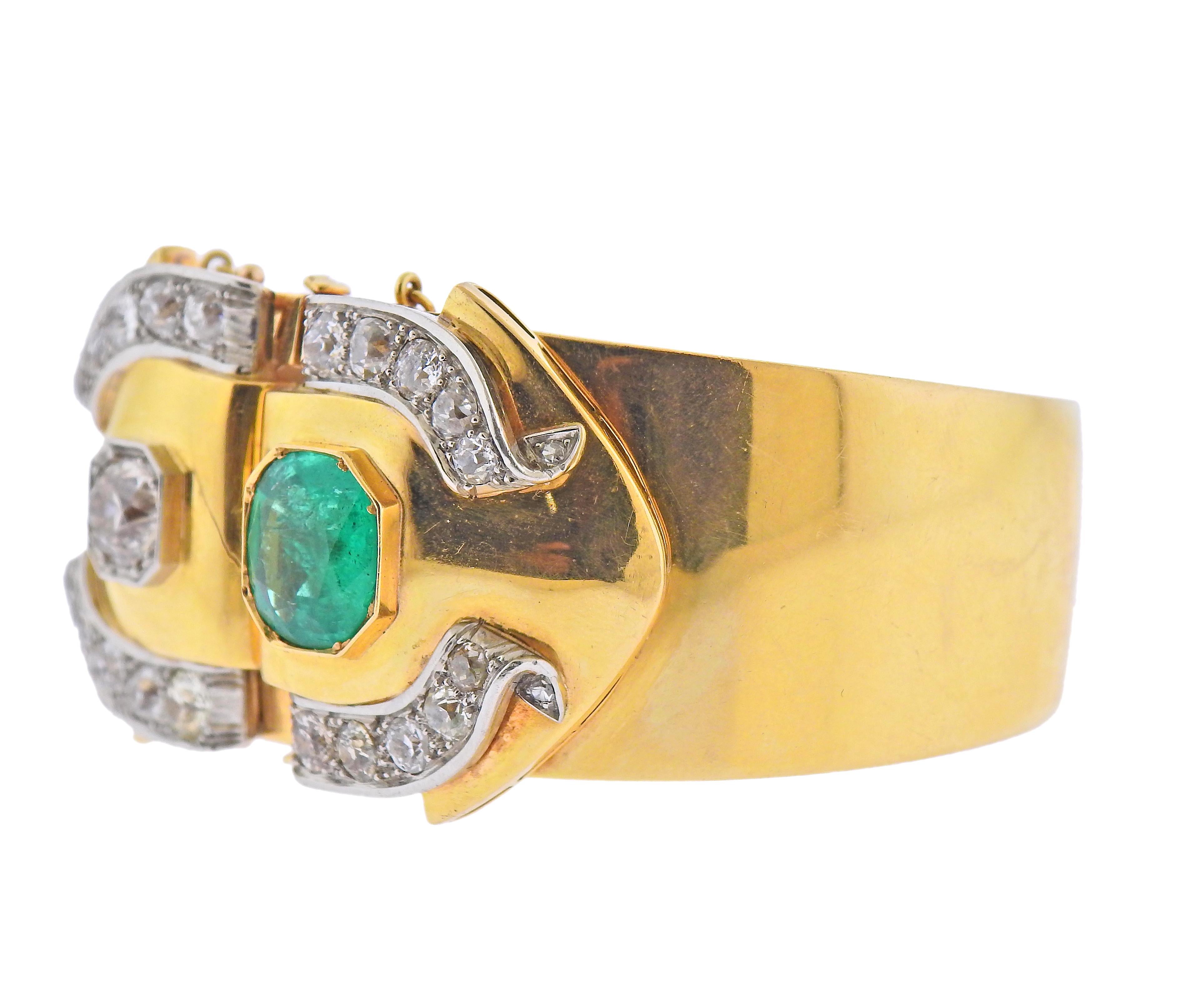 Antique 18k gold bangle bracelet, adorned with approx.  ( 5.50-6.00ctw in old mine cut diamonds ( approx. 1.25ct center diamond) and 11mm x 10.3mm emerald. Bracelet will fit up to 7