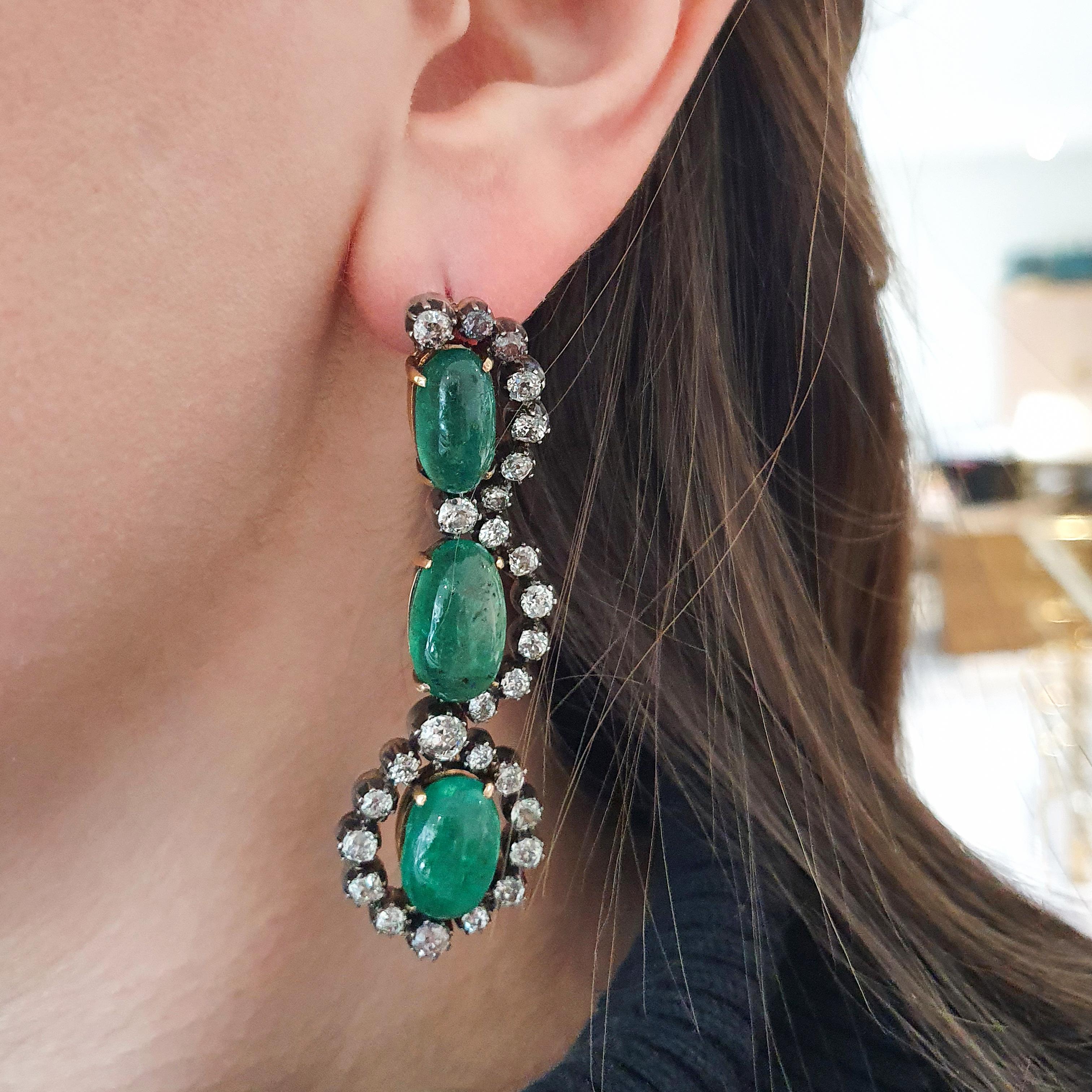 Presenting a truly exceptional piece from the former Austrian Royal Family collection, we have a breathtaking Cabochon Emerald surrounded by Old-mine cut diamonds, set on a backdrop of silver and gold. This magnificent jewel, dating back to the mid