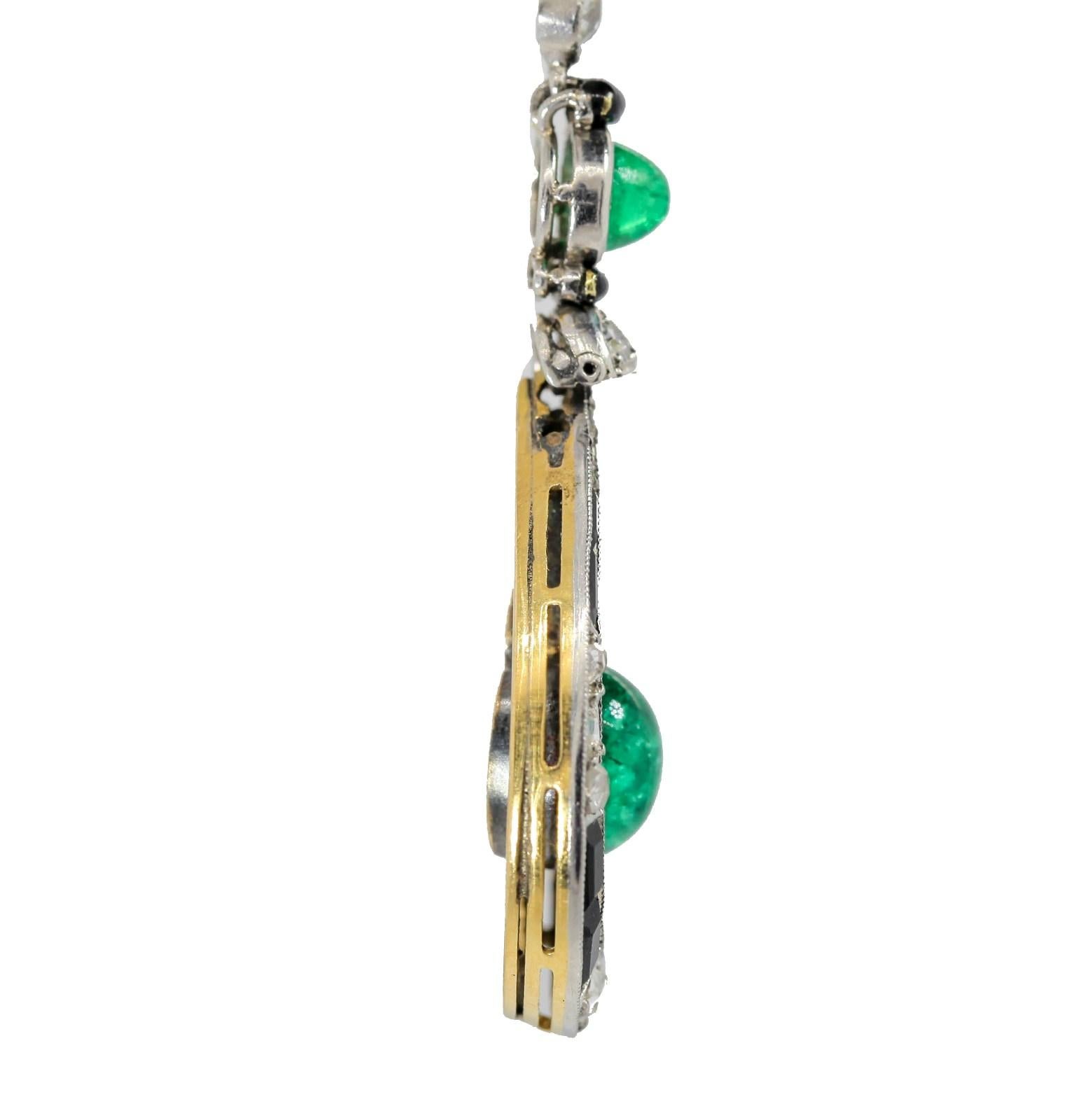 Circa 1920s  unique dangling earrings.  Rose cut Diamond flower tops suspend pear shape frames set with old cut diamonds, calibre Onyx  and Colombian Emeralds.  The centers dangle diamond bars ending in larger cabochon Colombian Emeralds  All old
