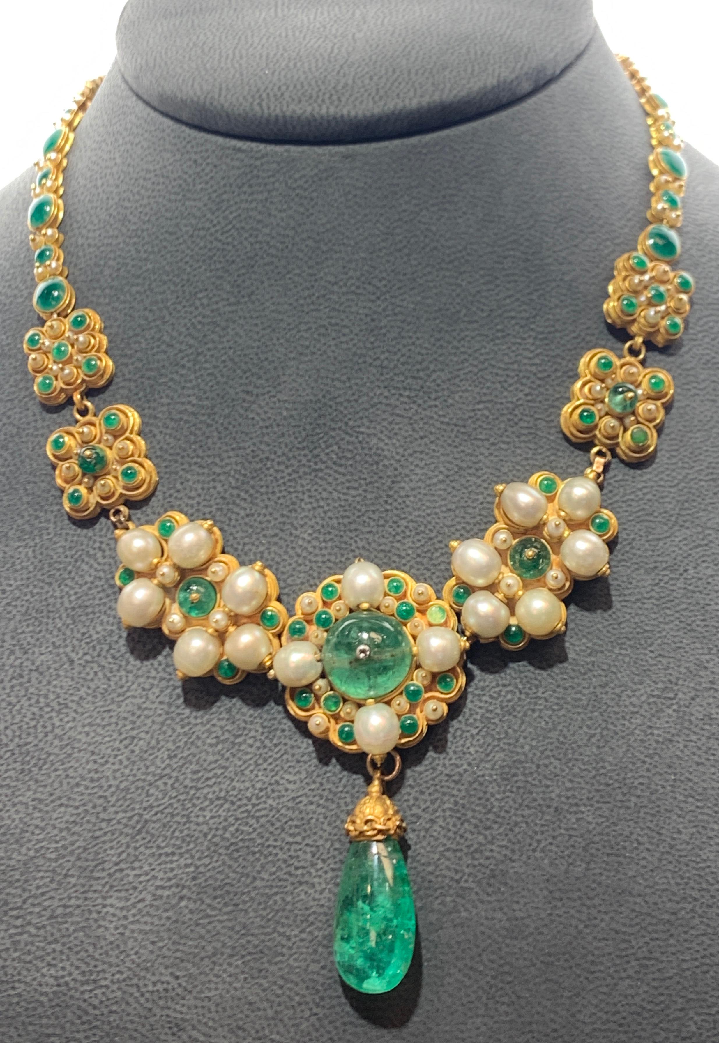 Antique Emerald Pearl and Enamel Necklace

18K and 14k Yellow Gold with removable emerald drop
Green enamel on the reverse. Dated 1907
6 emeralds approximately 34 carats
Measurements: 16.5