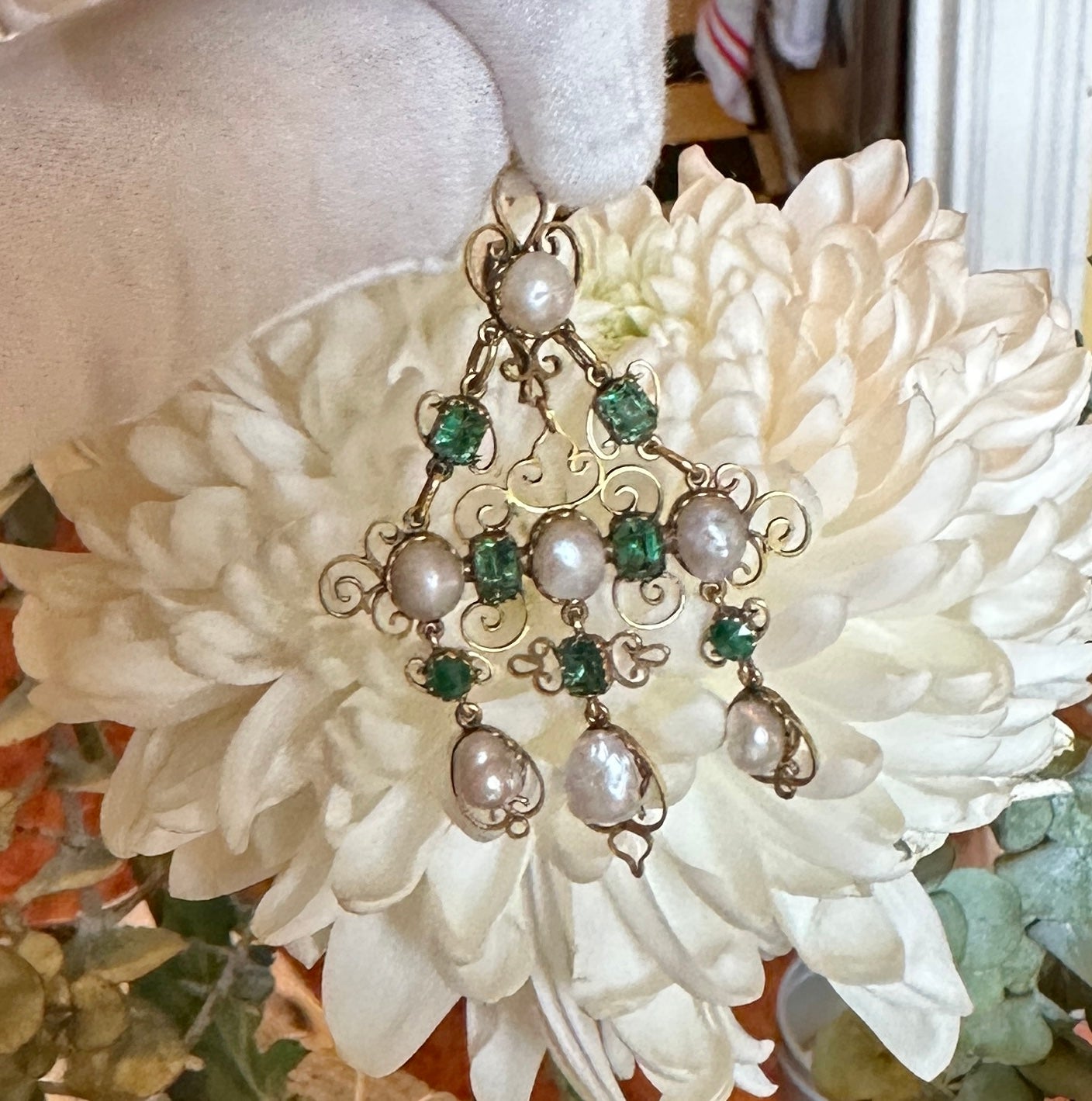 This is a magnificent Emerald and Pearl Pendant necklace dating to the 19th Century.  It is in the Renaissance Revival style and dates to circa 1870.  There are five gorgeous natural mined rectangular cut and two round cut vivid green Emeralds with