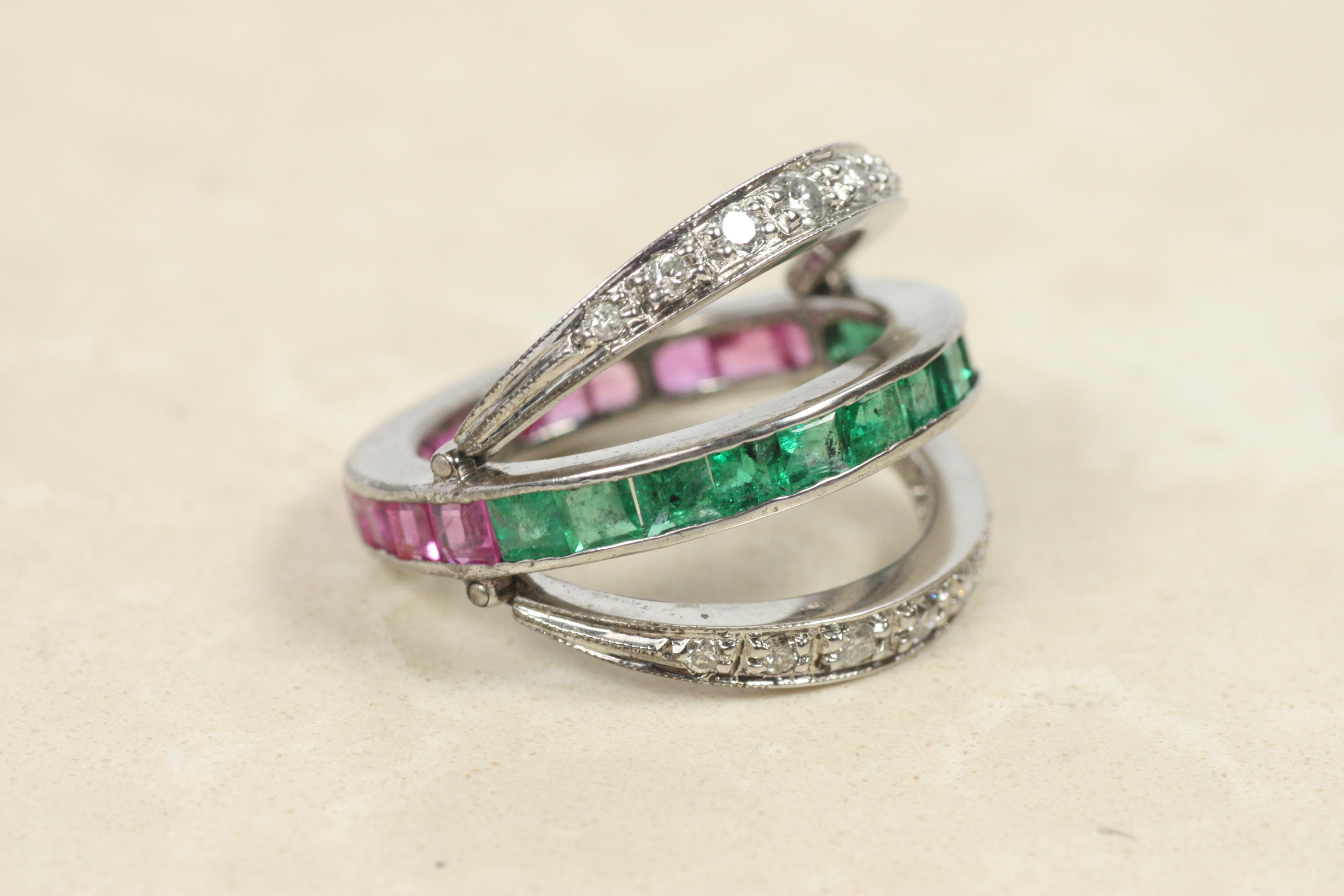 This antique reversible ring provides ultimate versatility–hinged bands give the option of a ruby and diamond combination, or emerald and diamond. A fine estate piece that has stood the test of time, circa 1930, crafted in 10K white gold. The
