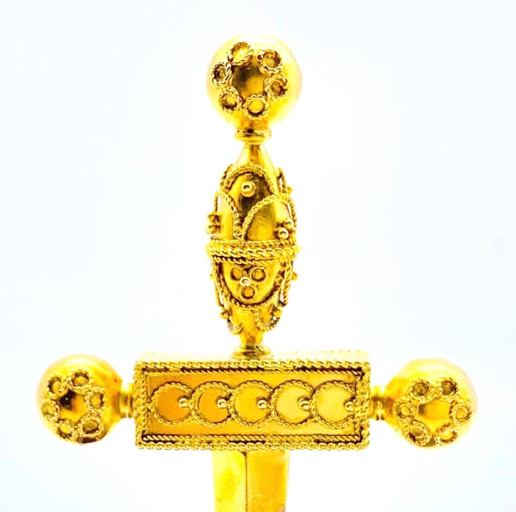 gold and emerald dagger