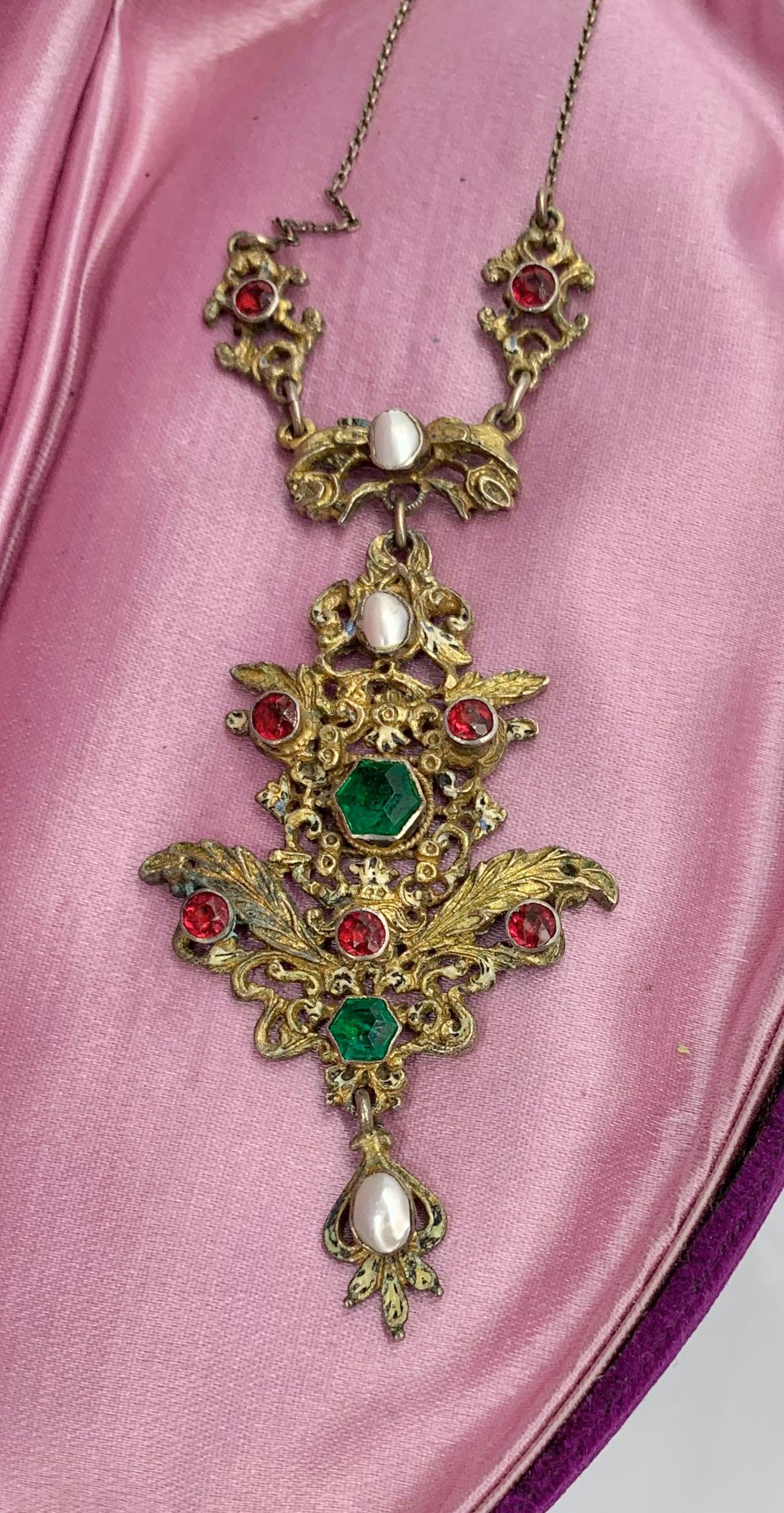 This is a magnificent piece of Austro-Hungarian Emerald Ruby and Pearl jewelry.  It is in the Renaissance Revival style and dates to circa 1870.  The gems are all set in silver gilt as was the custom of the Austro-Hungarian jewels.  The piece has