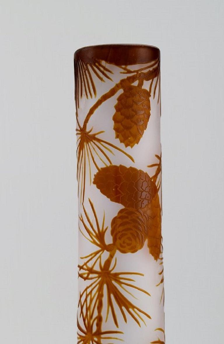 Antique Emile Gallé vase in frosted and light brown art glass carved in the form of spruce cones and branches. 
Early 20th century.
Measures: 34 x 12.5 cm.
In excellent condition.
Signed.