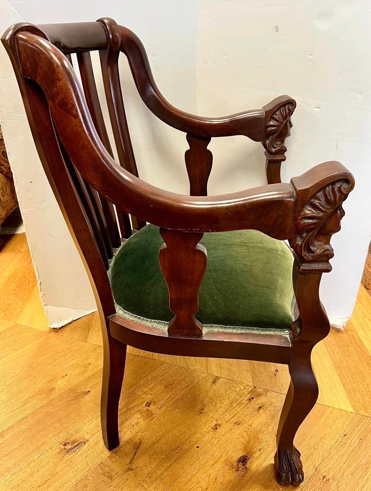 antique wooden chair with armrest