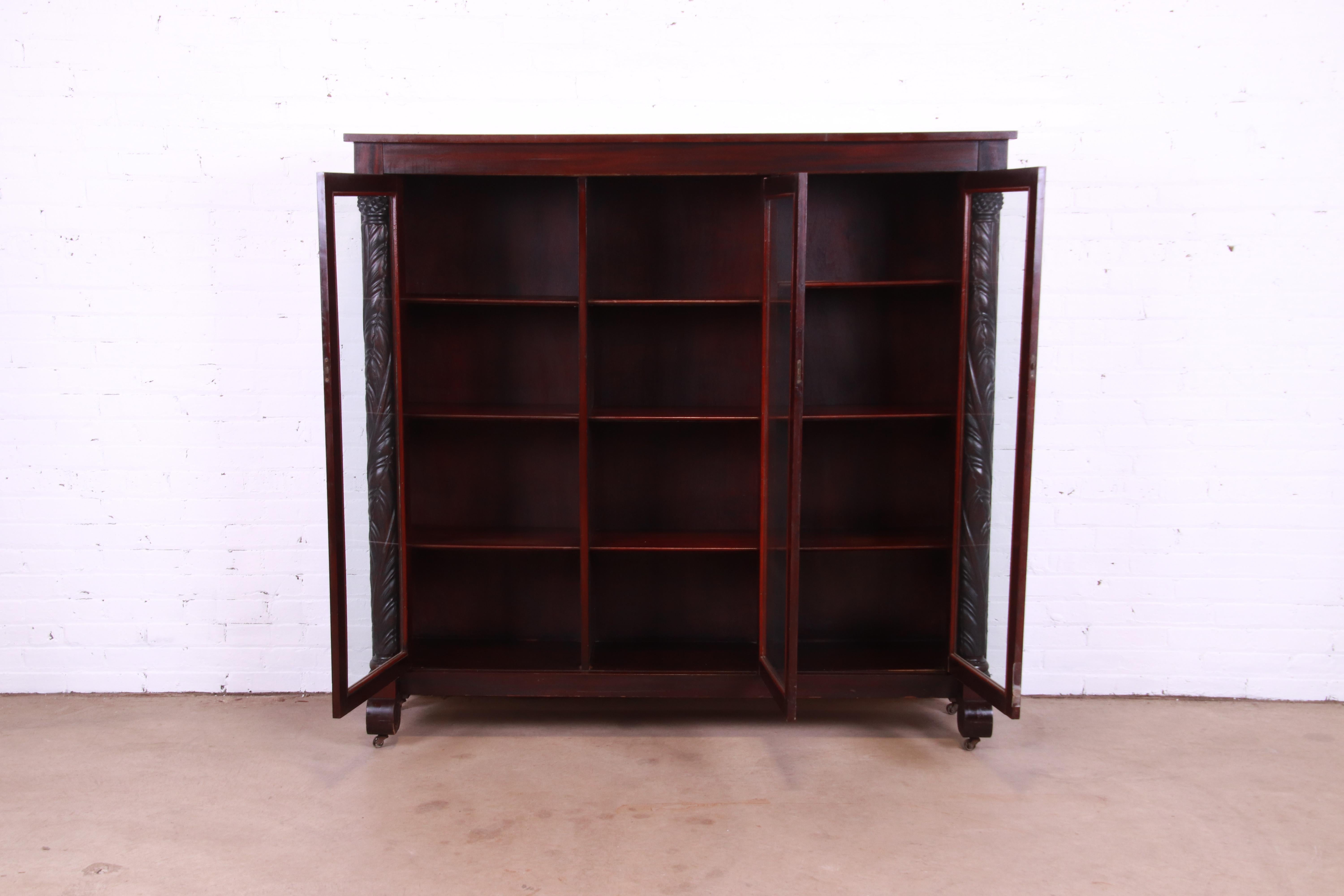 Antique Empire Carved Mahogany Glass Front Triple Bookcase, circa 1900 2