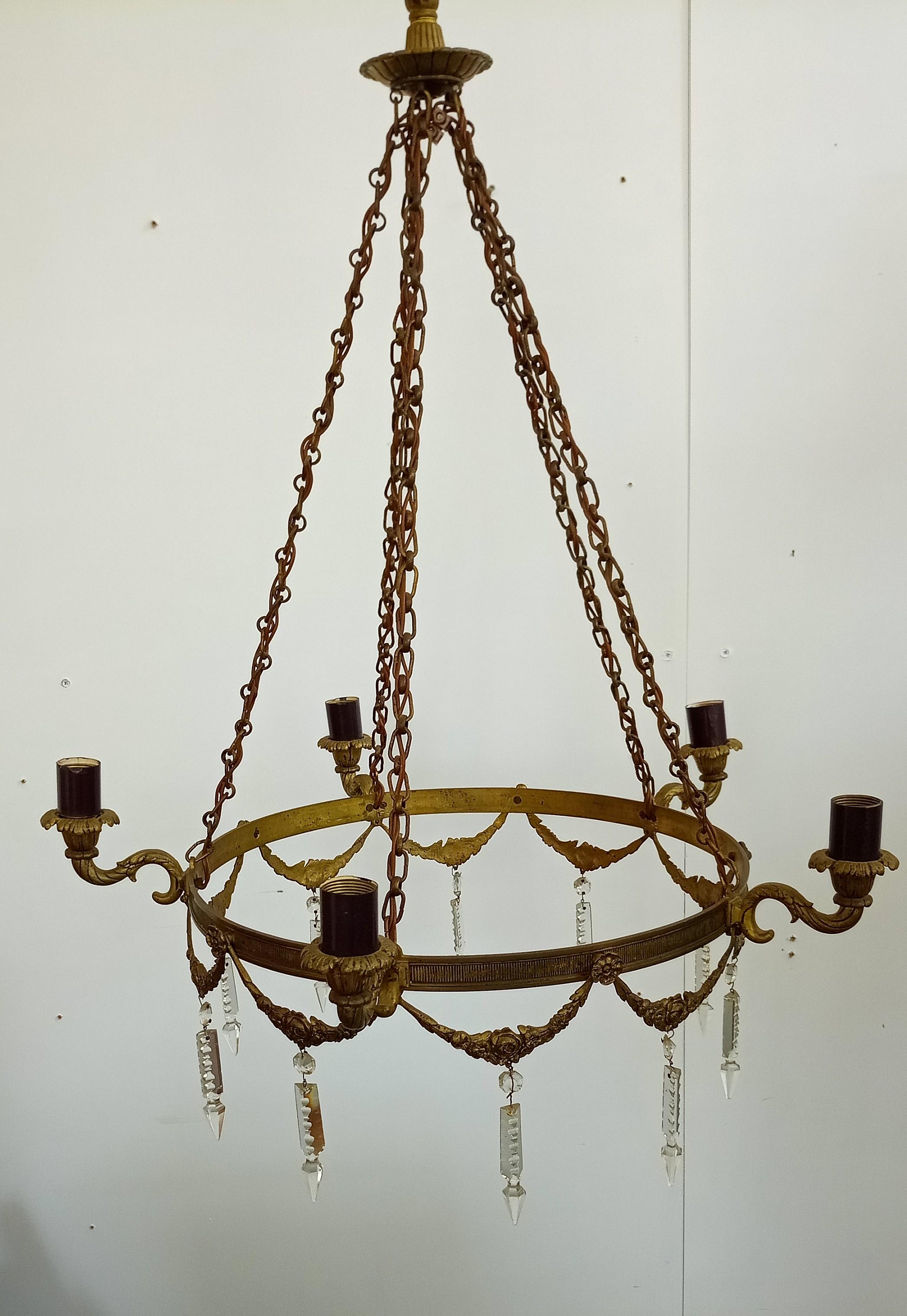 high decorative antique bronze candelier from the empire.
I guess the chandelier was electrified later .
