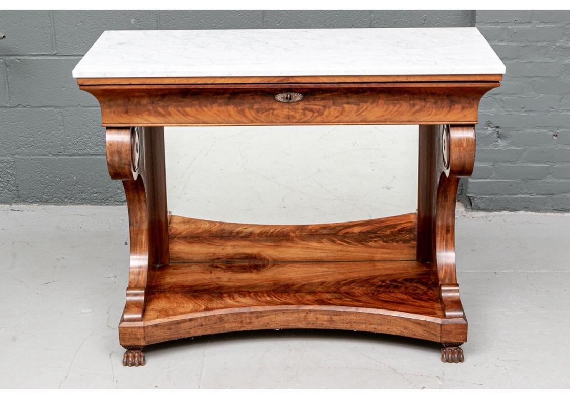 Notable antique Empire console table with marble top, mirrored base, decorated with bold 5 1/2