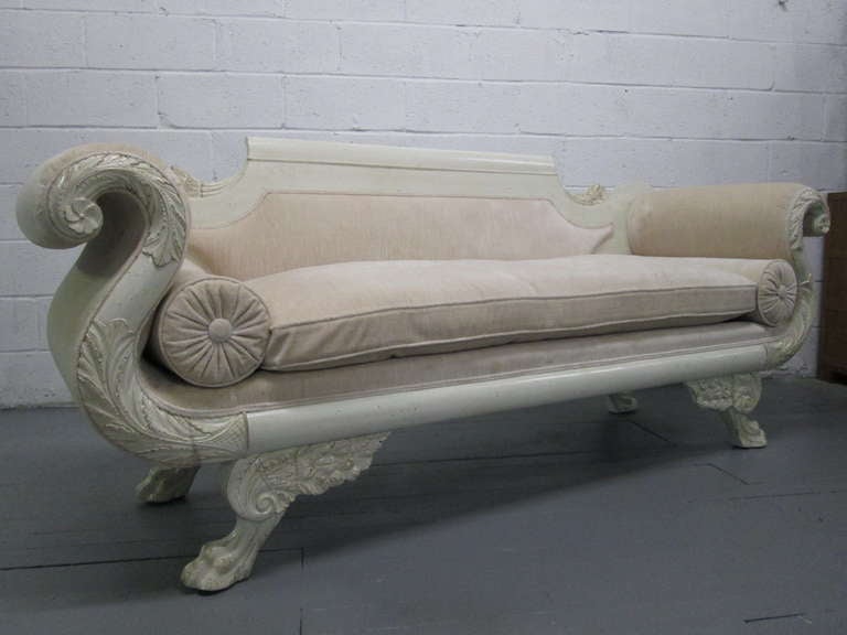 Custom painted Empire sofa. Sofa has a down filled seat cushion. Legs and frame has carvings.