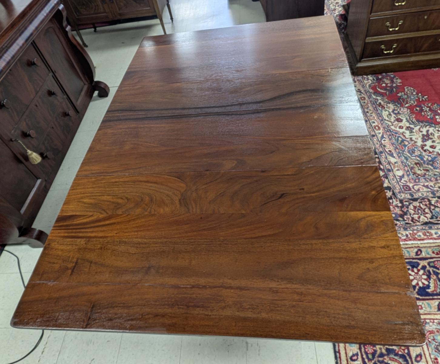 Antique Empire Drop Leaf Table, Mahogany, Circa 1890's​
Antique
Drop Leaf
Solid Mahogany
Smooth top folds down on both sides
Entire table rest on pedestal base with scrolled feet
On casters
Measures: Closed 30