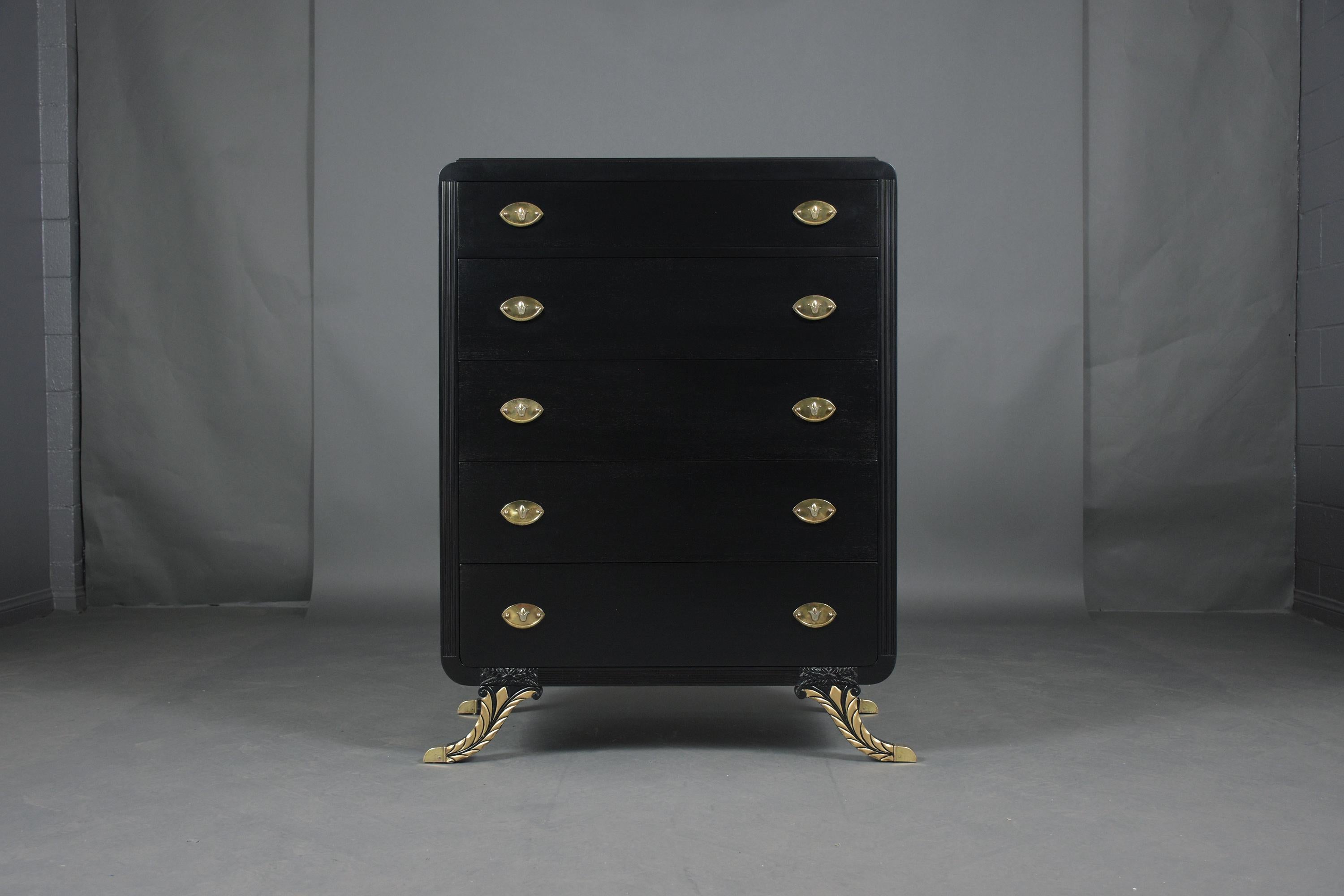An extraordinary empire-style high dresser hand-crafted out of mahogany wood in great condition and newly restored by our craftsmen. This chest is a perfect addition to a sophisticated bedroom decor that features new elegant ebonized color with a