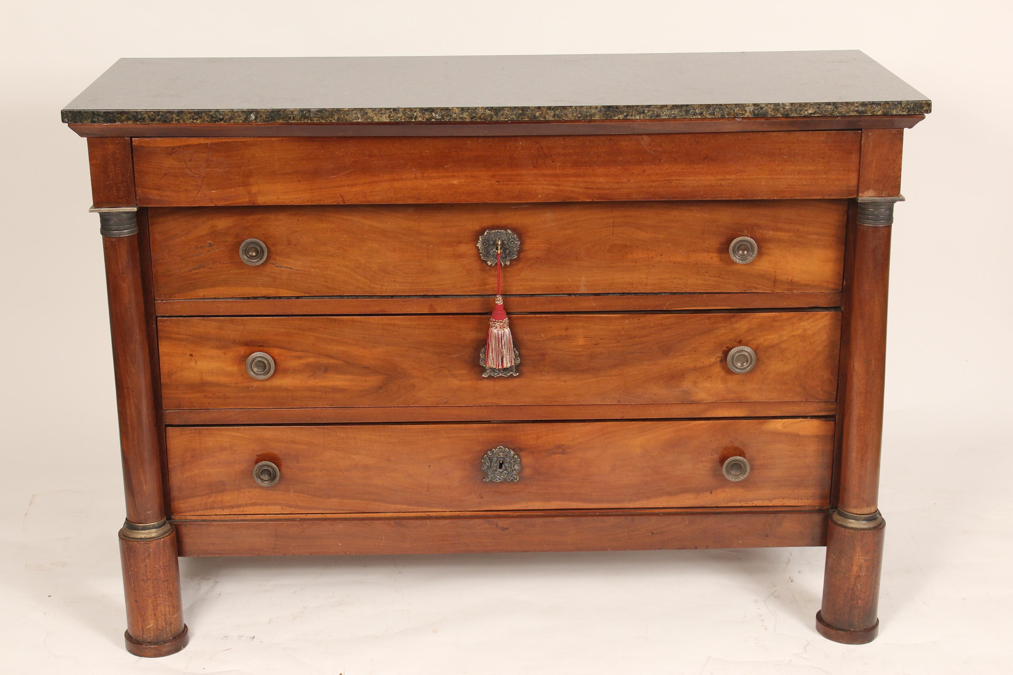 Antique Empire fruit wood chest of drawers with marble top, circa 1820. The marble top is late 20th century. With old light fruit wood color, two columns flanking the 4 drawers, dove tail construction on both drawers and case. Neo classical chest