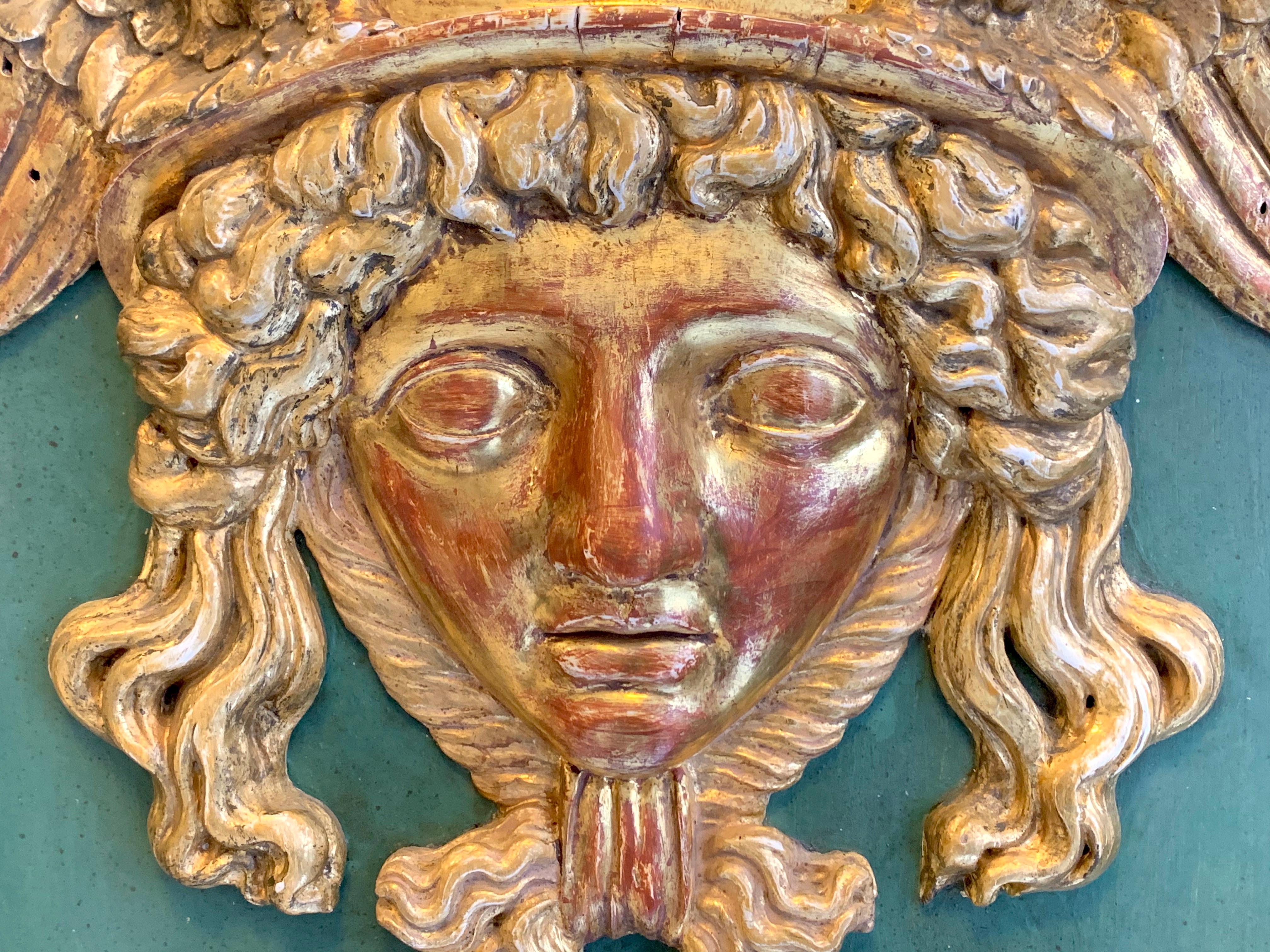 This beautiful head of Hermes wearing his winged helmet is carved out of boxwood and has preserved the original gilding. The head is mounted on a blackened oak board retaining it's original seagrass green paint.
This unusual relief was made in
