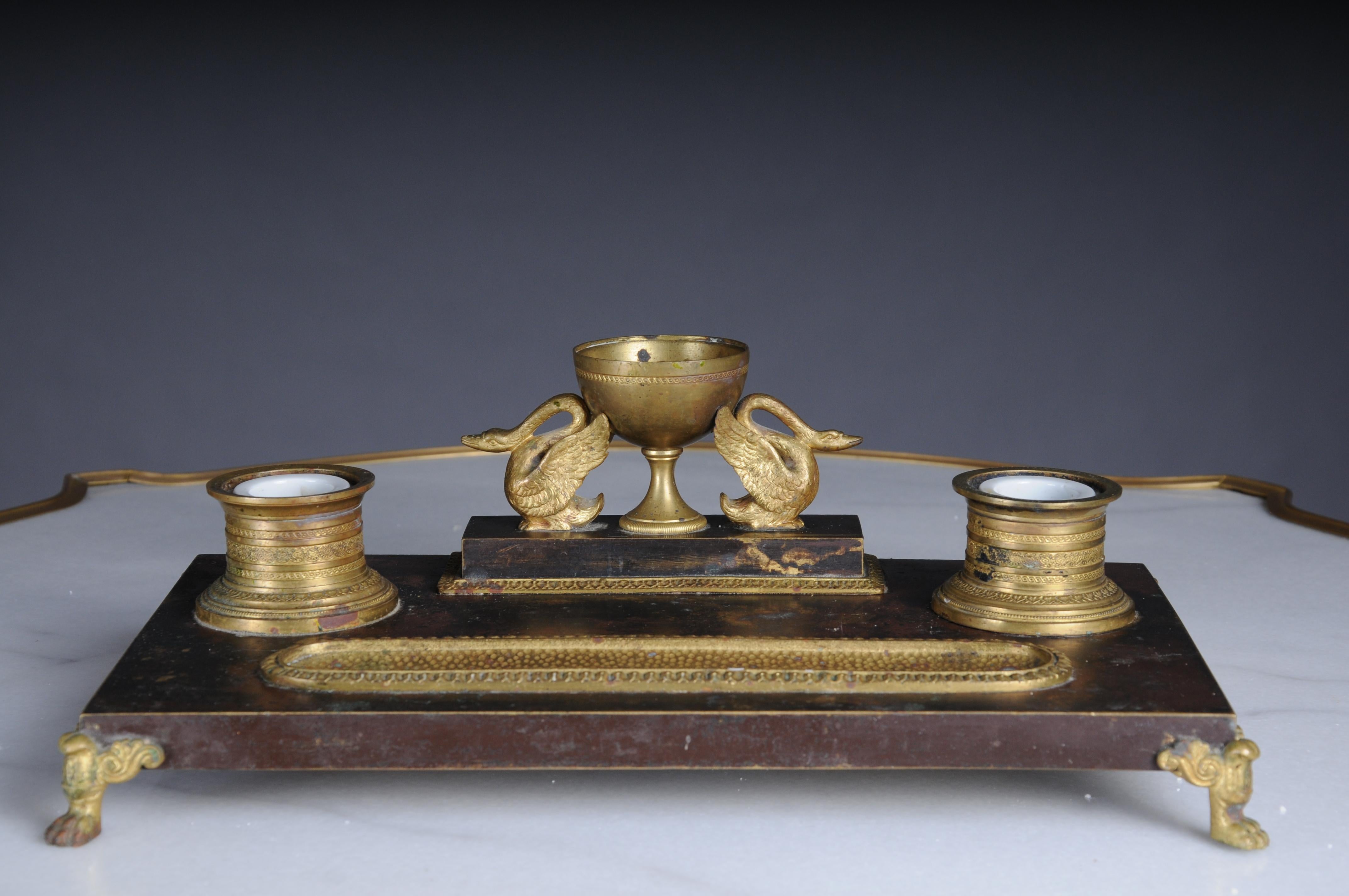 Antique Empire ink set, gold-plated bronze with swans, France

Solid bronze, partially gold-plated. Ink set in symmetrical arrangement. Very elegant and high-quality workmanship.

France around 1880-1890