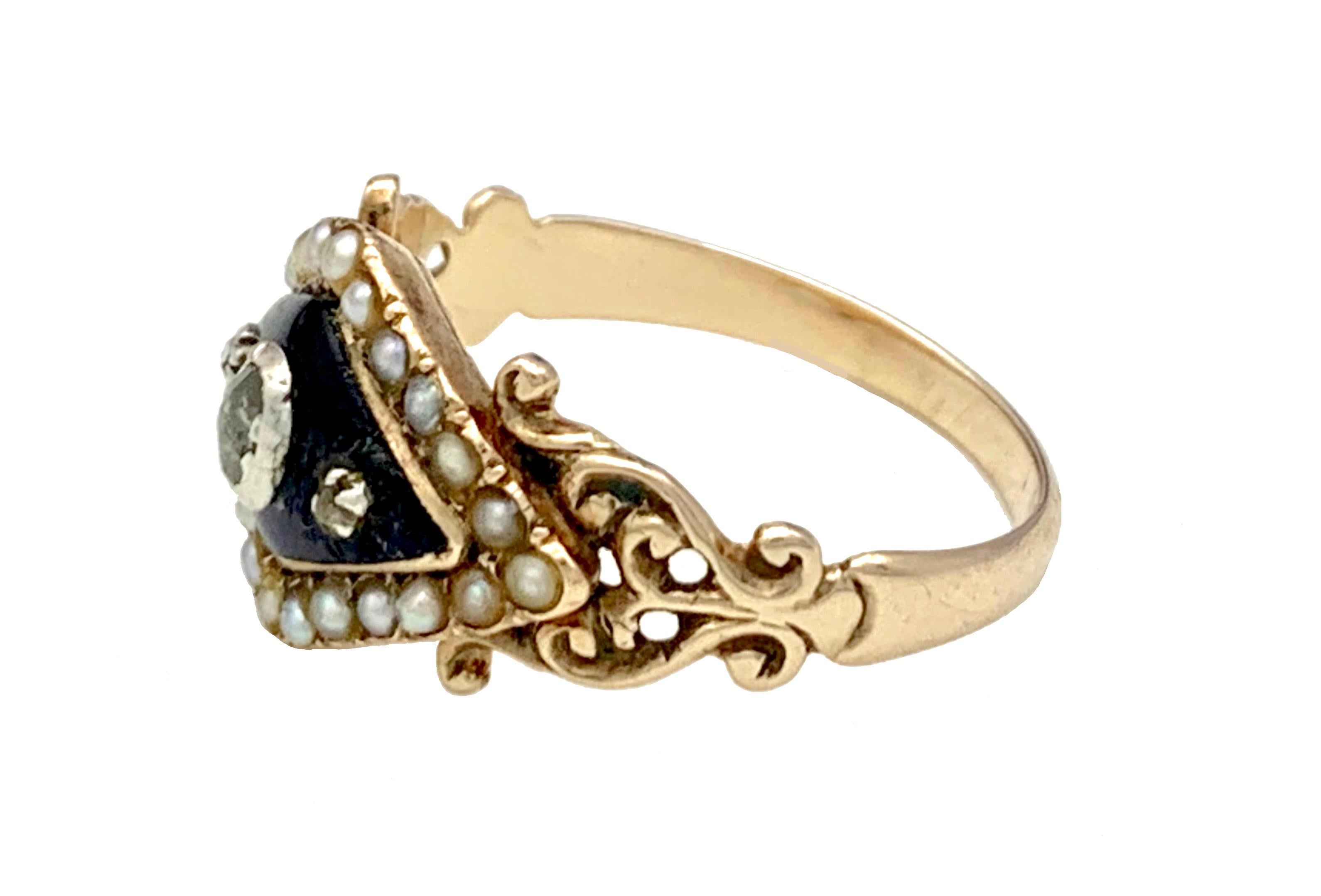 This fine and delicate Empire ring is designed as a night blue enamelled lozenge set with 3 silver set diamonds within a natural oriental pearl surround. The lozenge is held by openwork ring shoulders leading to a simple band. The ring is engraved
