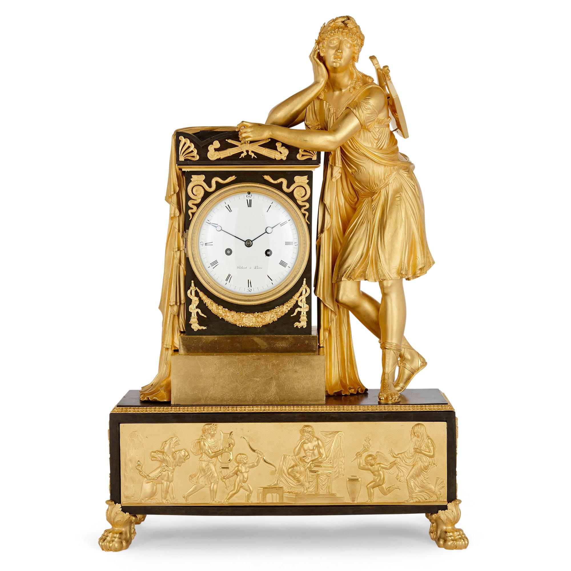 Antique Empire period neoclassical style mantel clock
French, circa 1810
Dimensions: Height 68cm, width 47cm, depth 20cm

This early 19th century French mantel clock is finely crafted from gilt and patinated bronze in the Neoclassical Empire