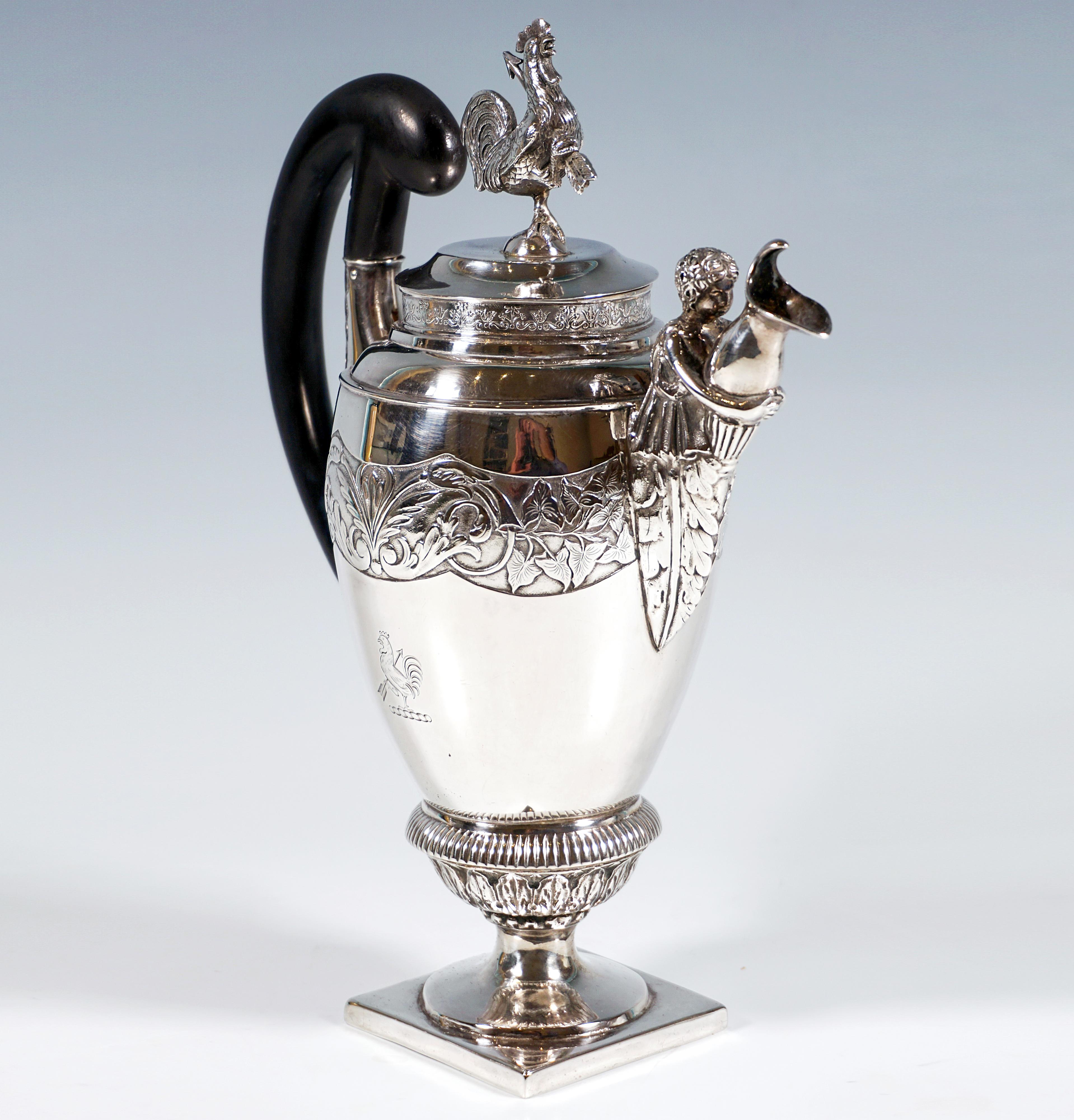 Empire silver lidded jug with a stepped, funnel-shaped foot on a square plinth, a large fluted ring decorated with acanthus leaves, in which the smooth, raised bulbous vessel rests, in the upper part of the wall a broad wavy frieze with feather and