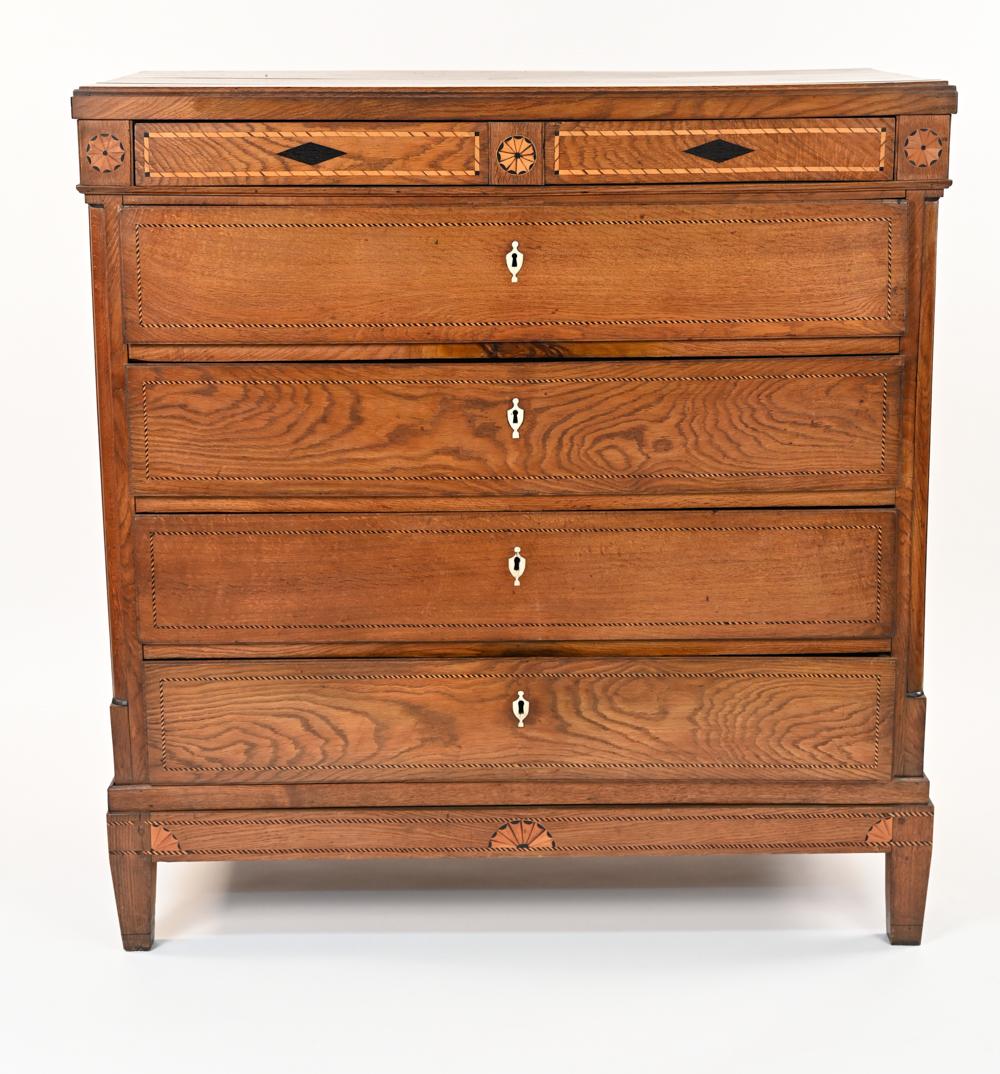 This handsome antique inlaid chest of drawers is in the Empire style, c. 1850. Featuring a body of elm wood with inlaid details.