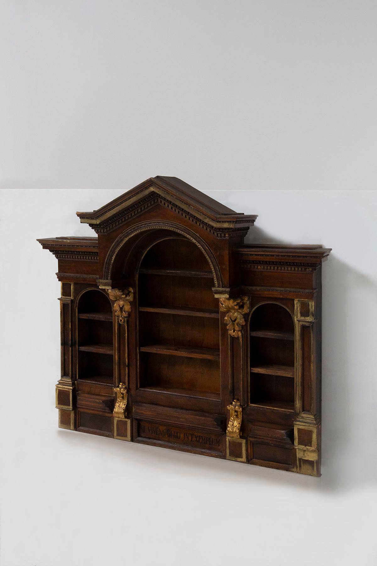 Behold an exquisite testimony to the grandeur and craftsmanship of the Empire style: an elegant hanging cabinet or antique bookcase, masterfully crafted from rich walnut wood and adorned with beautiful gilded inserts that shine like stars in the