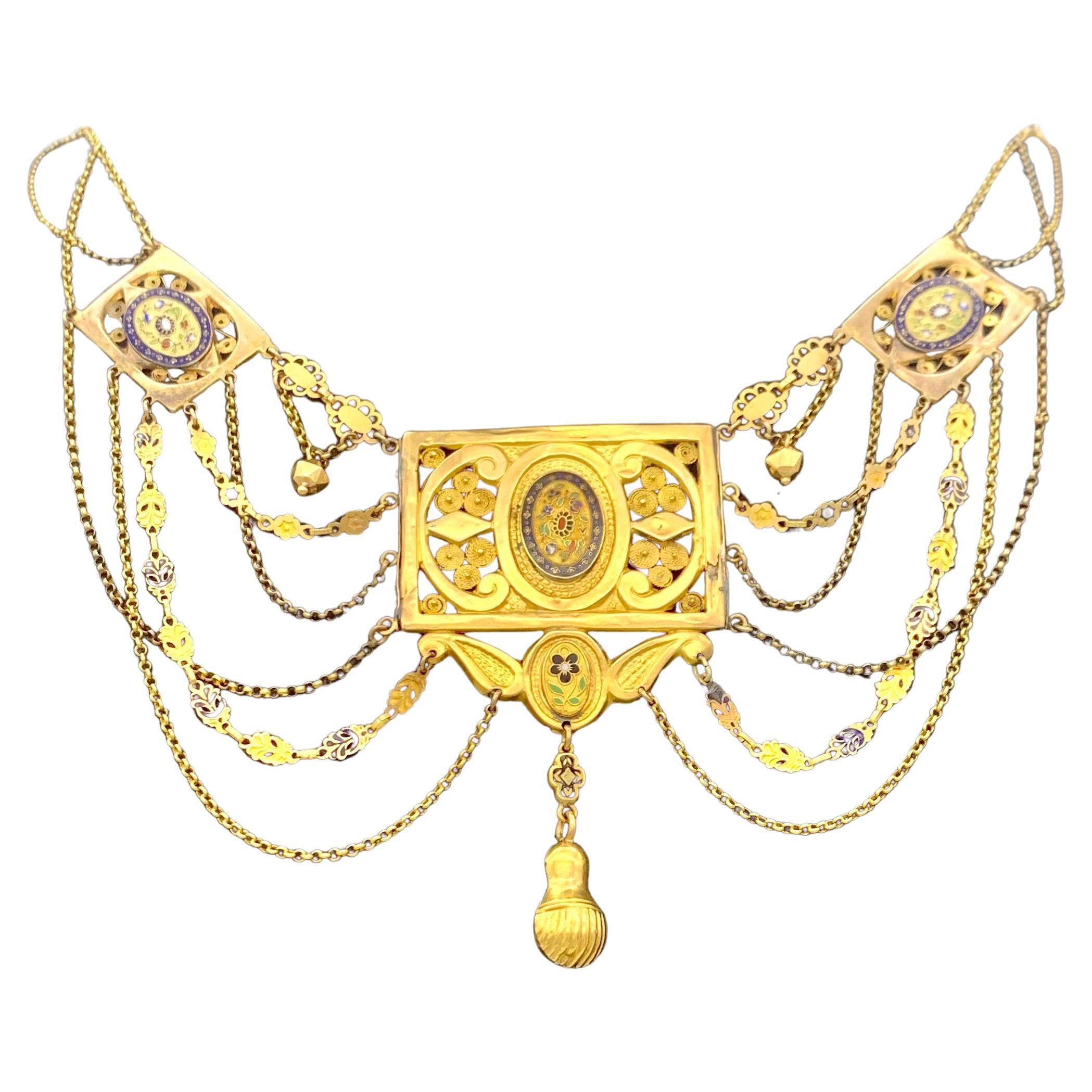 This rare necklace was handcrafted out of 18 karat gold in 1810 ca. It was worn by a bride and the iconographic language is full of sentimental conotations. The central rectangular element is connected to the two outer rectangular elements by a