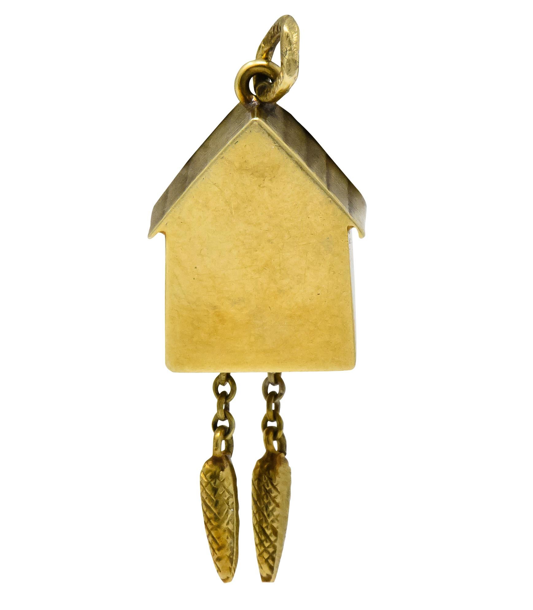 Designed as a cuckoo clock with open window for peeking bird when hanging weights are tugged

Remnant of green enamel on window shutter, loss consistent with age, wear, and use

Stamped 14k and Germany

Circa 1905

Measures: 1 x 1/2 inch

Total