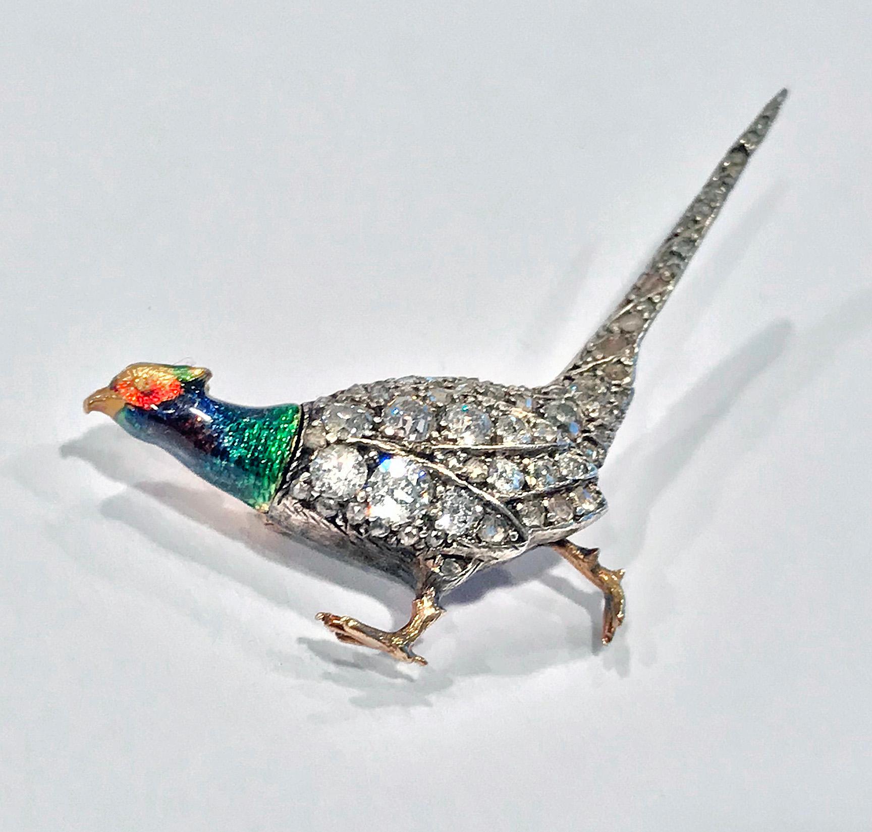 Antique Enamel and Diamond Pheasant Brooch, English C.1880. The body and tail encrusted with numerous old mine, european and rose cut diamonds. The head with striking green, blue, orange, gold and tones of mauve enamel. All set in gold on cut down