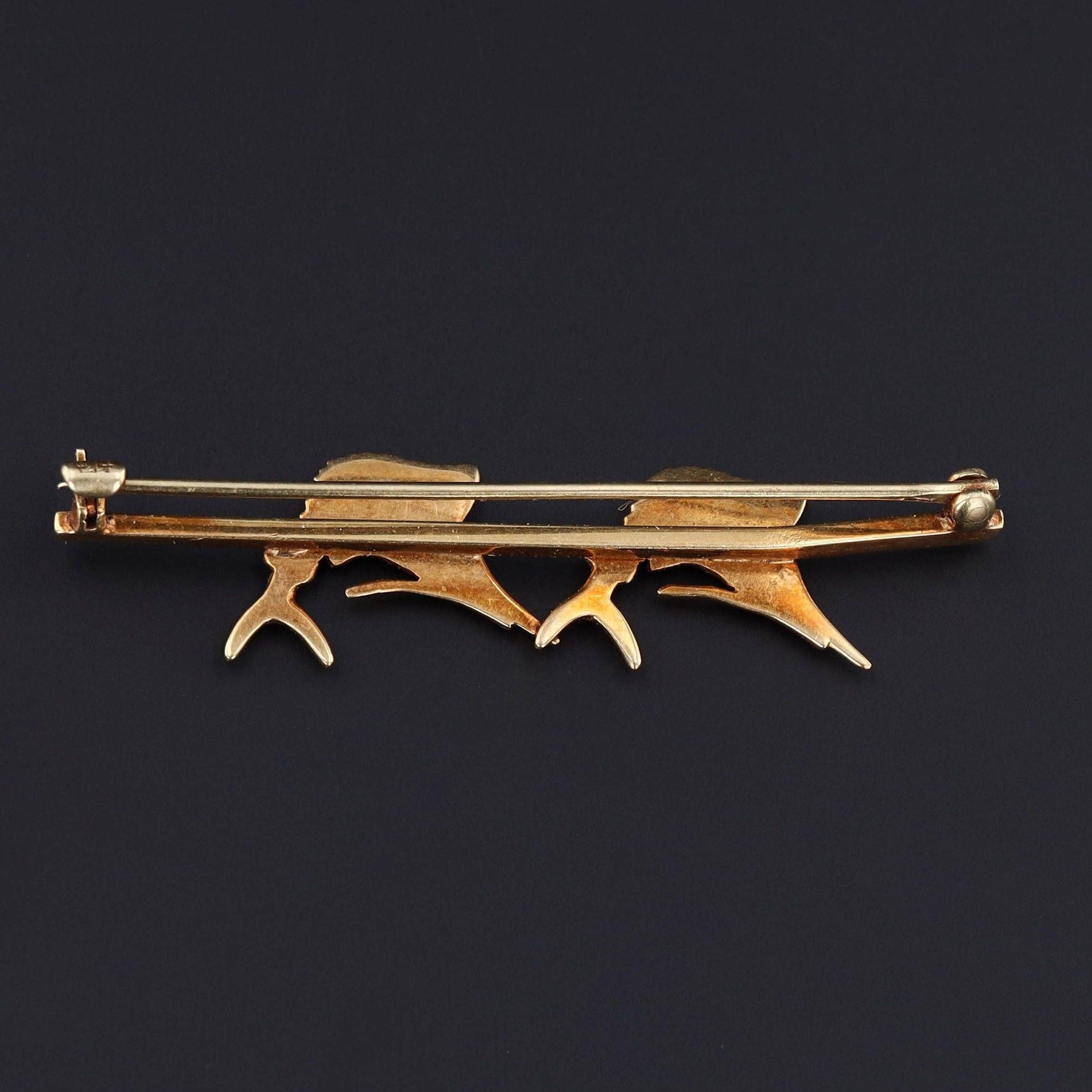 Antique Sloan & Co. Twin Sailfish Brooch in 14k Gold with Pearls, Rubies & Enamel, circa 1915–1920

Evoking the elegance and power of one of the ocean’s most iconic creatures, this antique brooch (circa 1915–1920) by Sloan & Co. captures a pair of